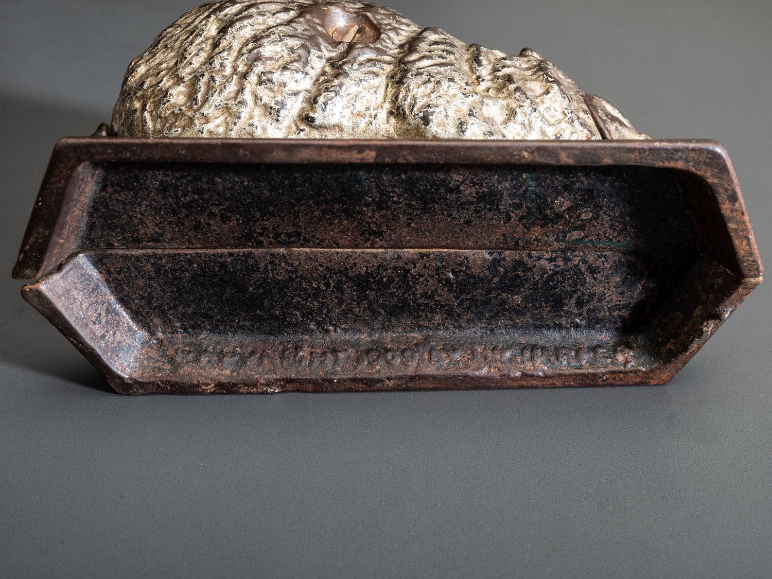 A 'Billy Possum' Cast Iron Still Bank