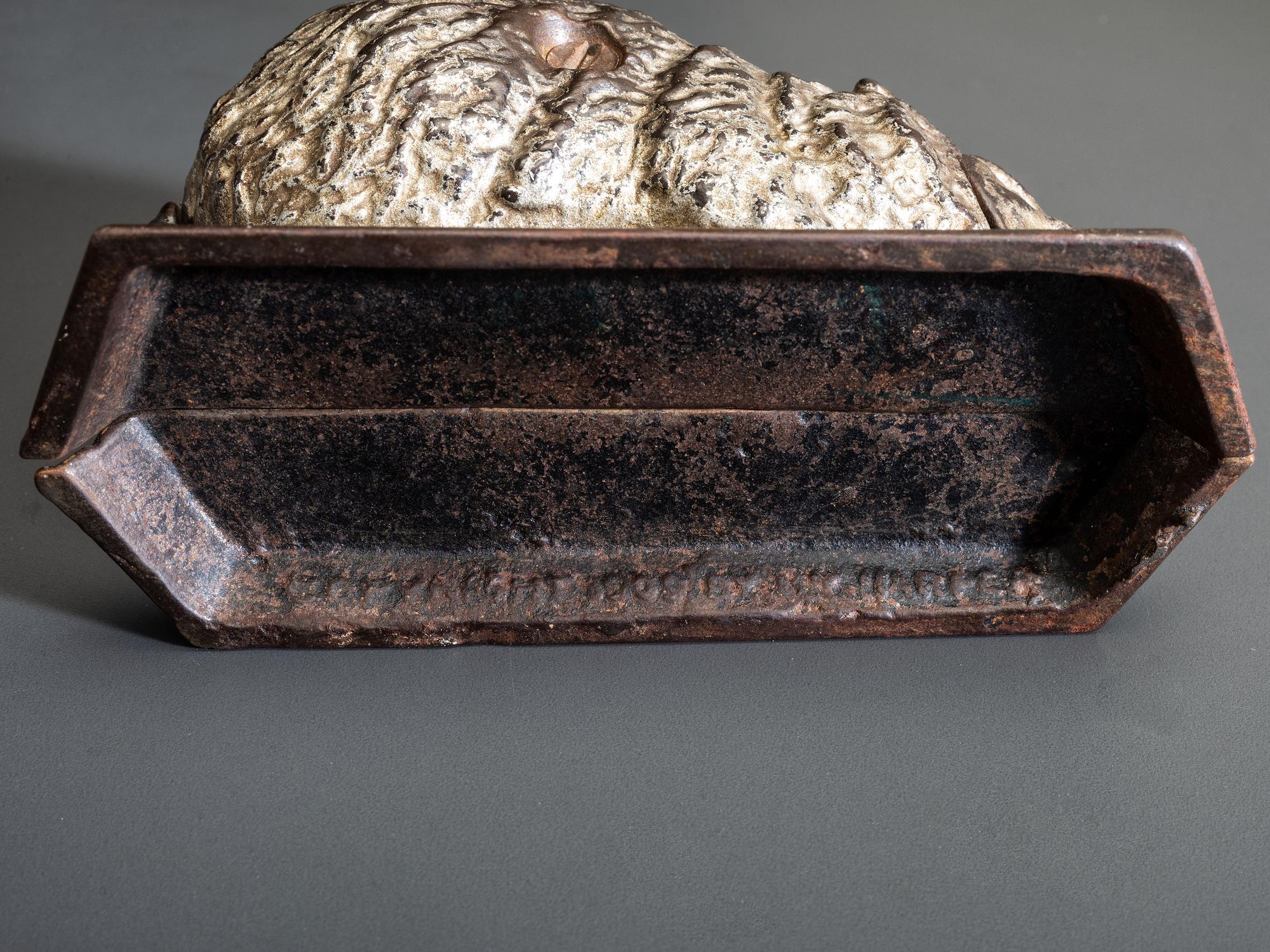 A 'Billy Possum' Cast Iron Still Bank