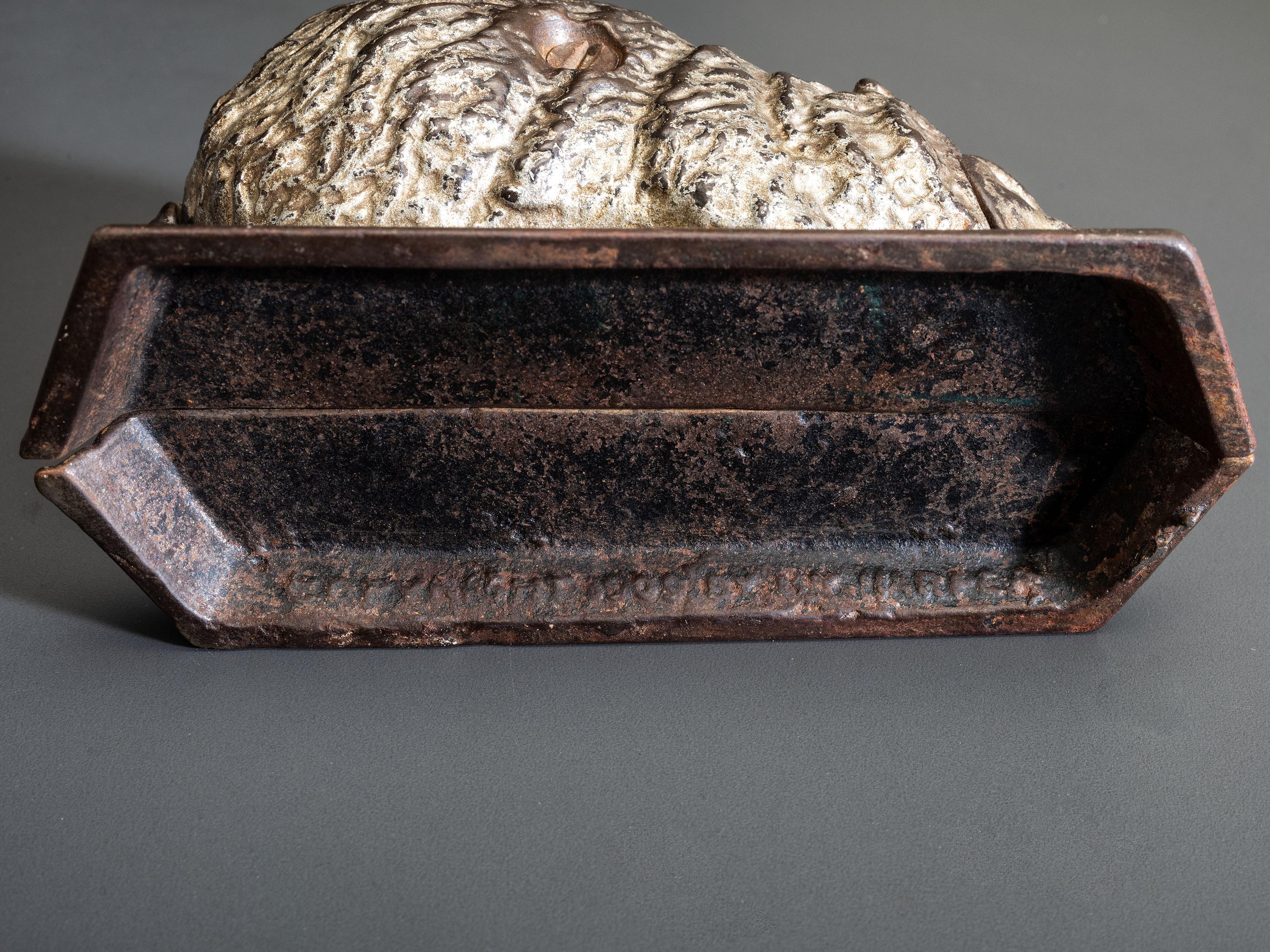 A 'Billy Possum' Cast Iron Still Bank