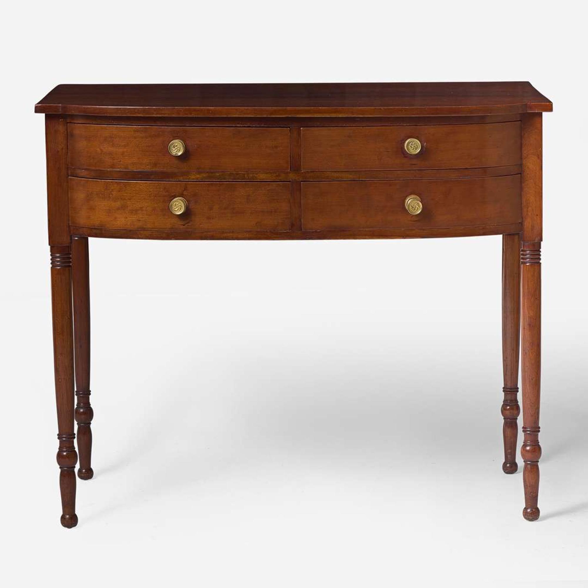 A Federal bowfront cherry sideboard or serving table, circa 1810