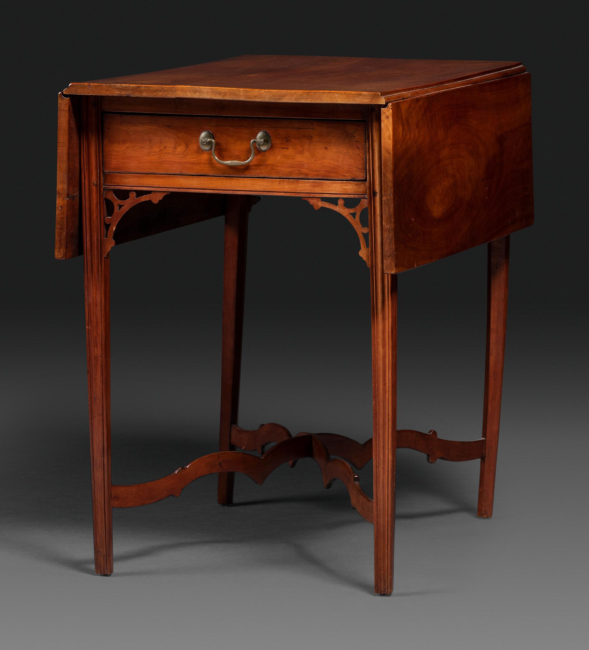 A Late Chippendale Carved Cherrywood Stretcher-Base Pembroke Table