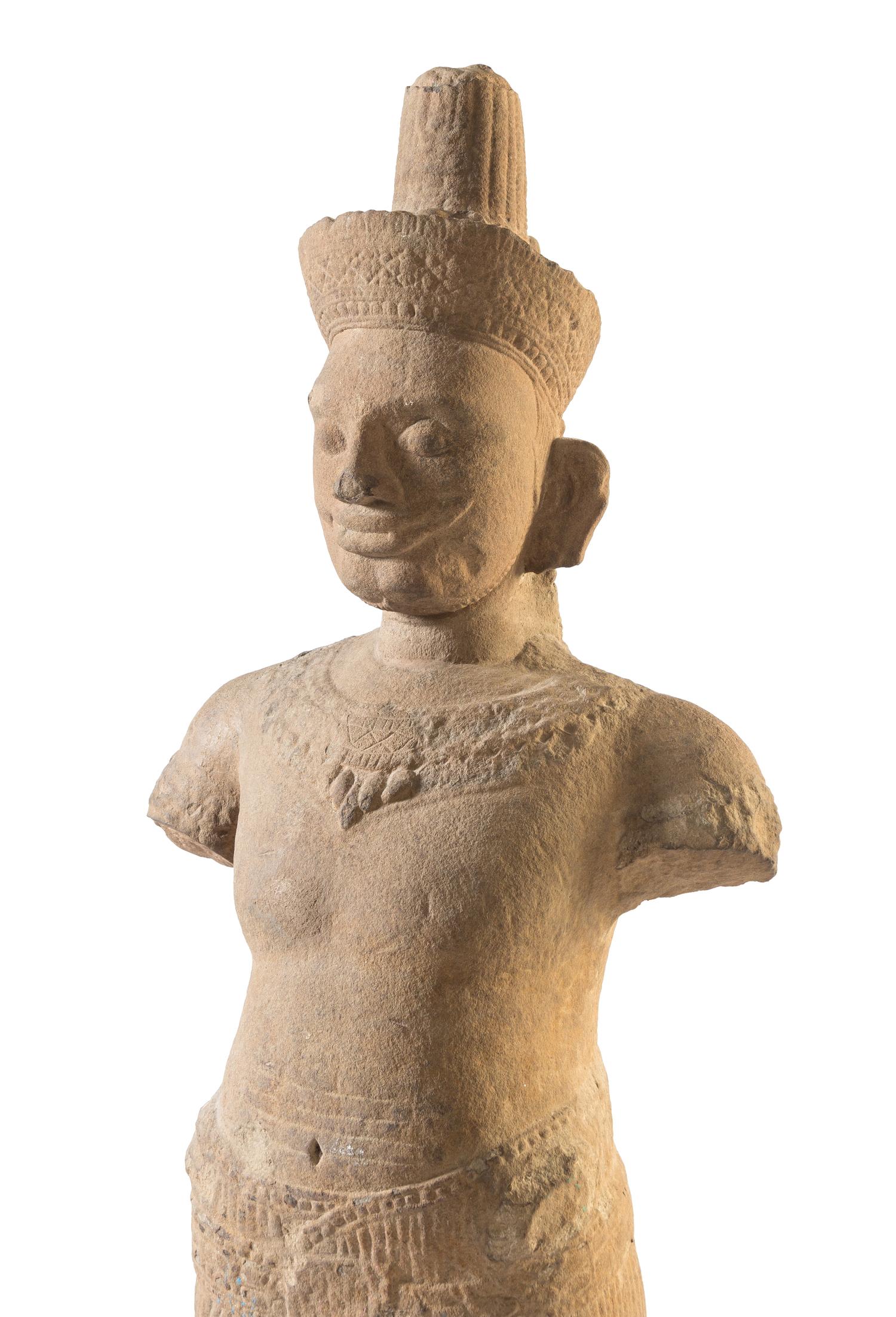 A Khmer Sandstone Figure of a Male Deity Height of figure 58 3/4 inches. — POSSIBLY 10TH-12TH CENTURY