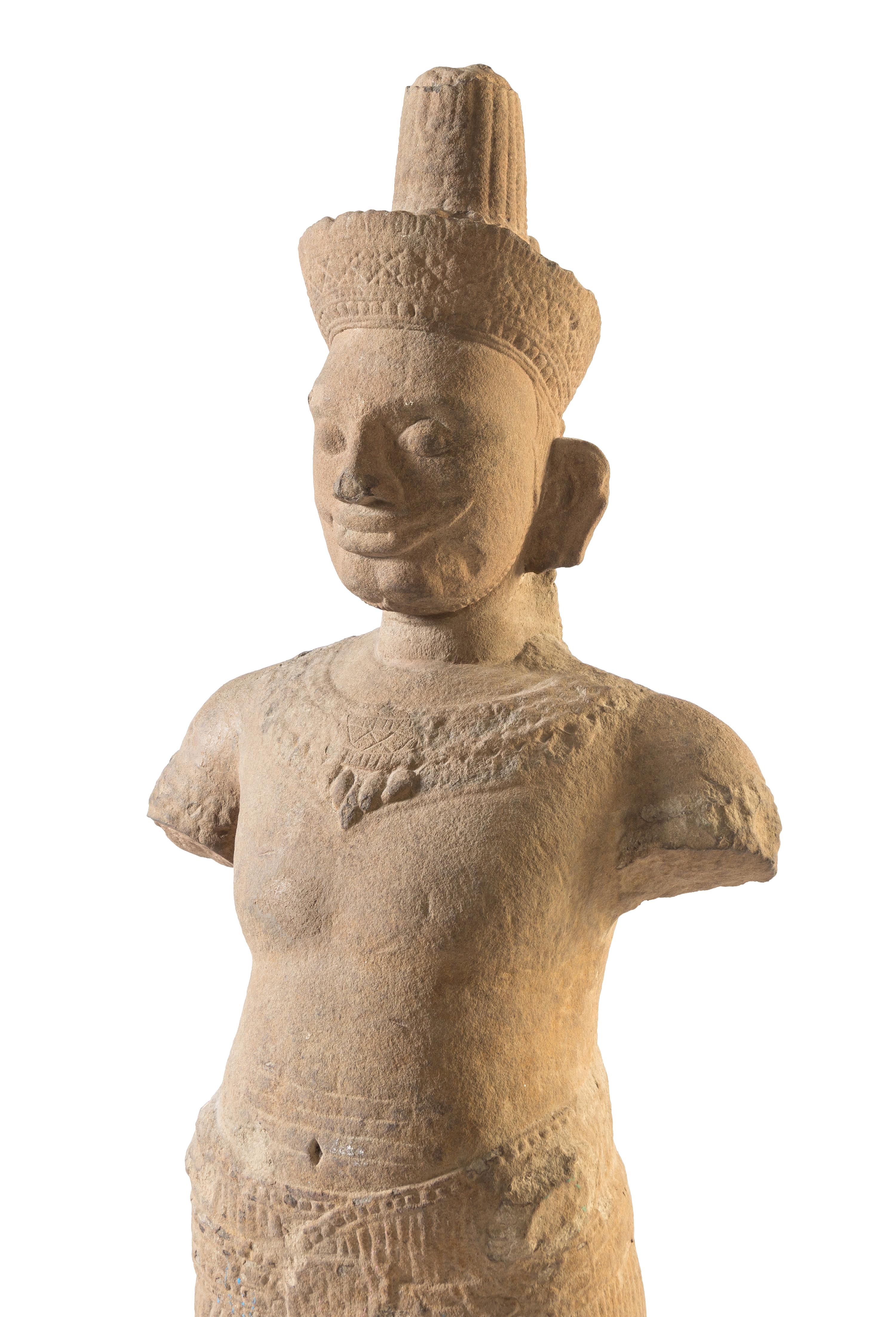 A Khmer Sandstone Figure of a Male Deity Height of figure 58 3/4 inches. — POSSIBLY 10TH-12TH CENTURY
