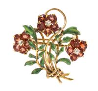 An Art Nouveau Yellow Gold, Garnet, Diamond and Polychrome Enamel Floral Spray Brooch, 3.50 dwts.