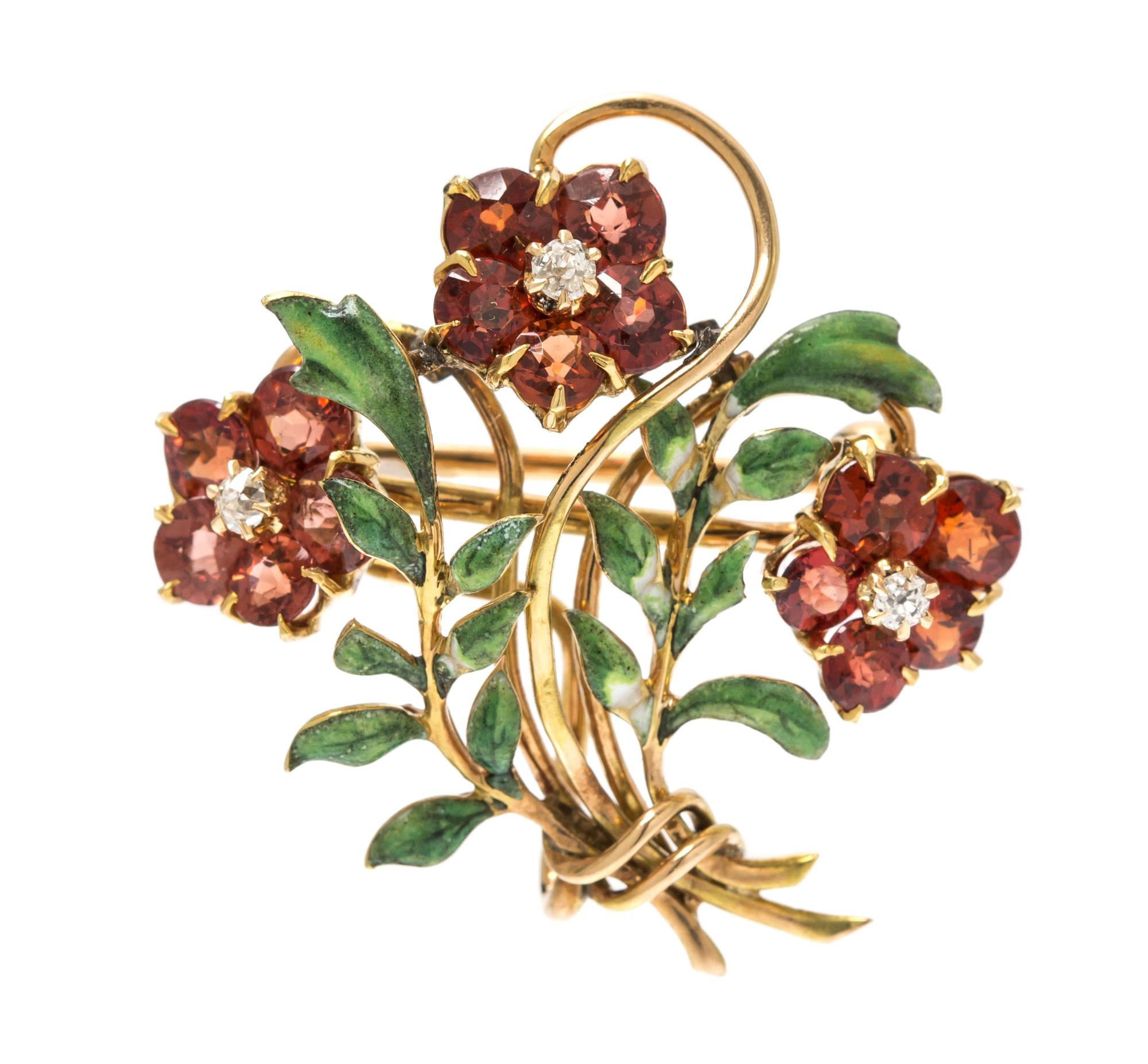 An Art Nouveau Yellow Gold, Garnet, Diamond and Polychrome Enamel Floral Spray Brooch, 3.50 dwts.
