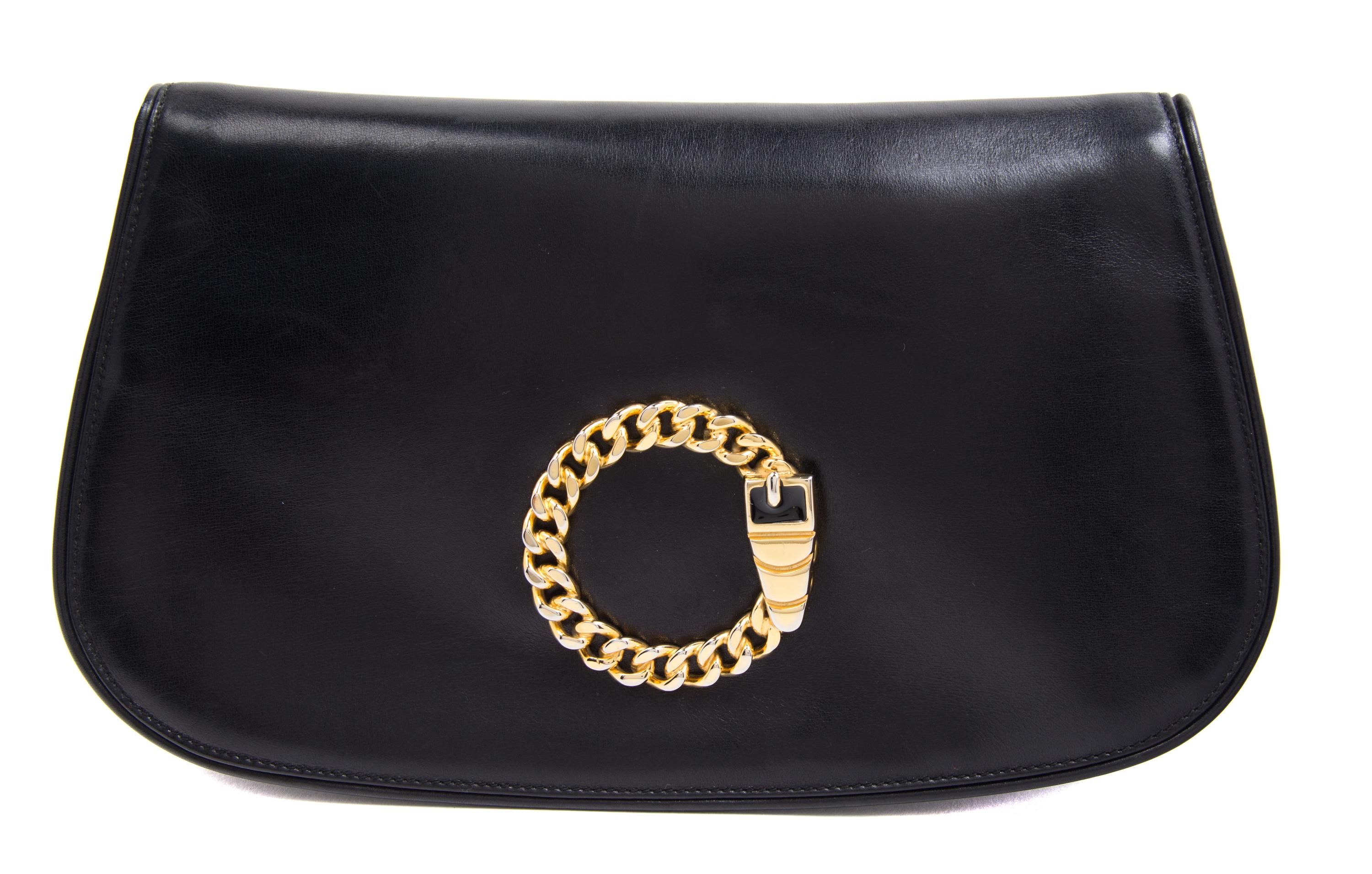 A Mark Cross Black Leather Clutch, 11" x 6.5" x 1".