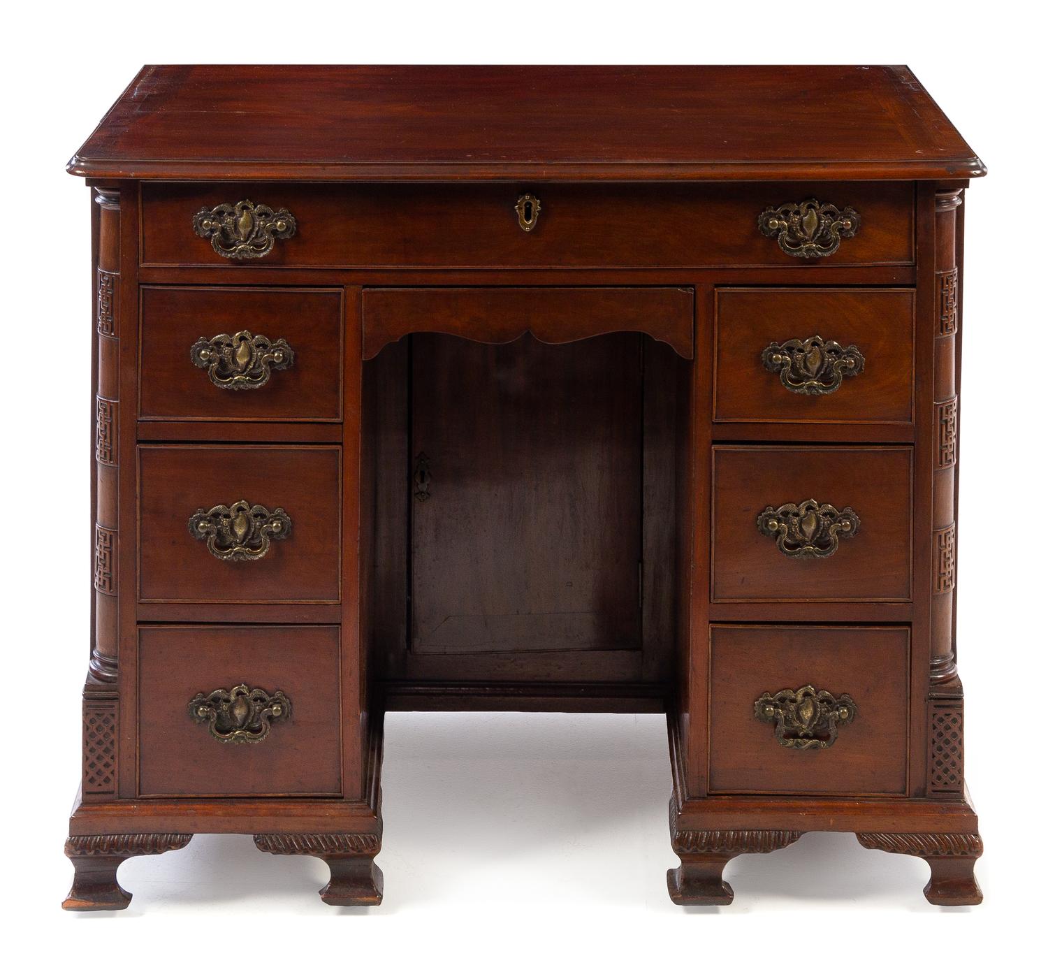 An English Mahogany Kneehole Desk Height 30 1/4 x width 36 3/8 x depth 21 inches. — 19TH CENTURY