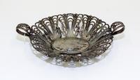 A Continental Silver Centerpiece Basket, , having open work decoration with foliate and bead motifs throughout.