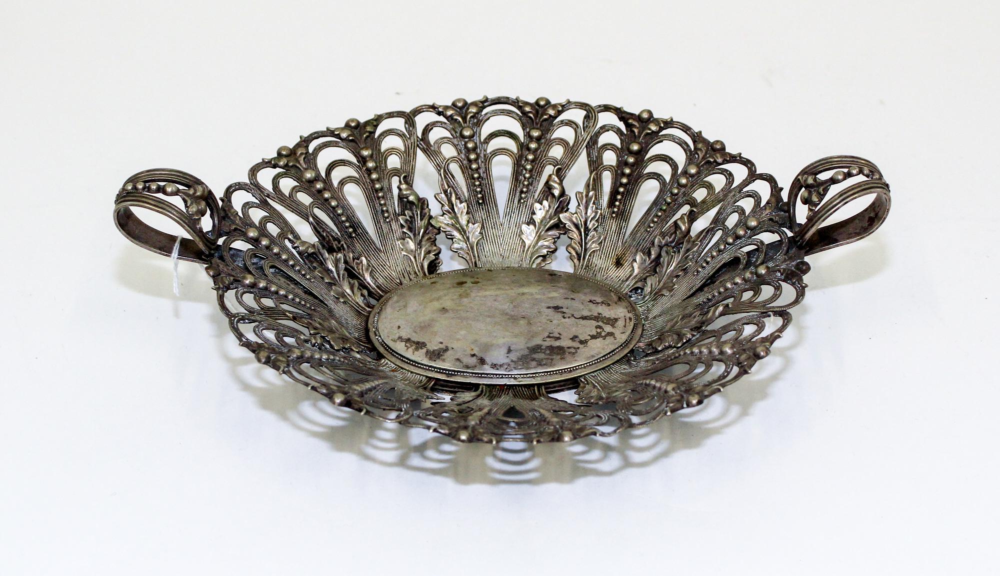 A Continental Silver Centerpiece Basket, , having open work decoration with foliate and bead motifs throughout.