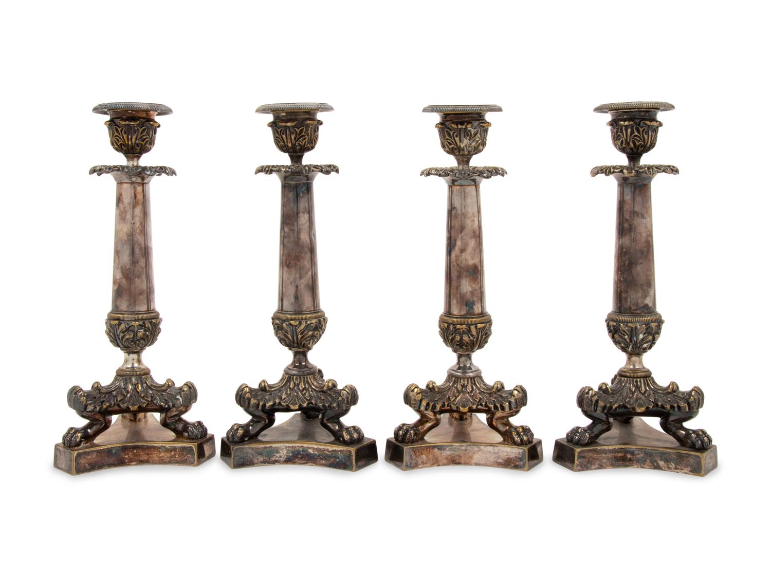 A Set of Four Neoclassical Silvered Bronze Candlesticks