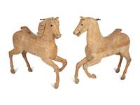 A Pair of Italian Carved Wood Carousel Horses in the Manner of Gustav Dentzel