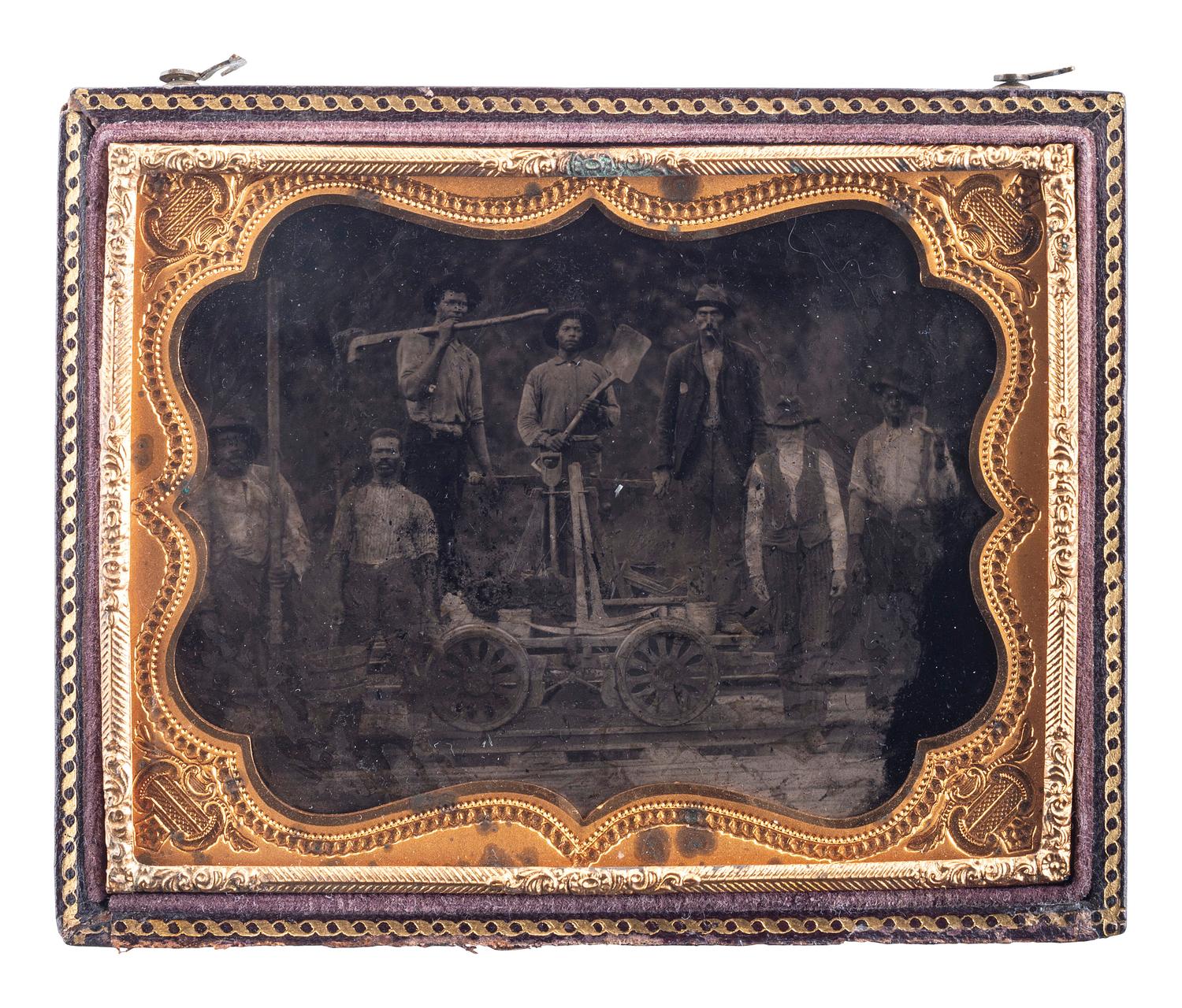 [EARLY PHOTOGRAPHY]. Quarter plate tintype of a group of railroad workers, incl. African American and white subjects.