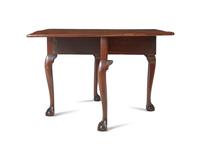 A Chippendale Carved and Figured Mahogany Drop-Leaf Dining Table, Philadelphia, PA, Circa 1775