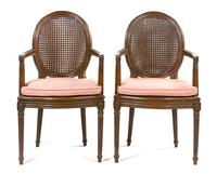 A Pair of Louis XVI Style Walnut Fauteuils, Height 38 1/2 inches.