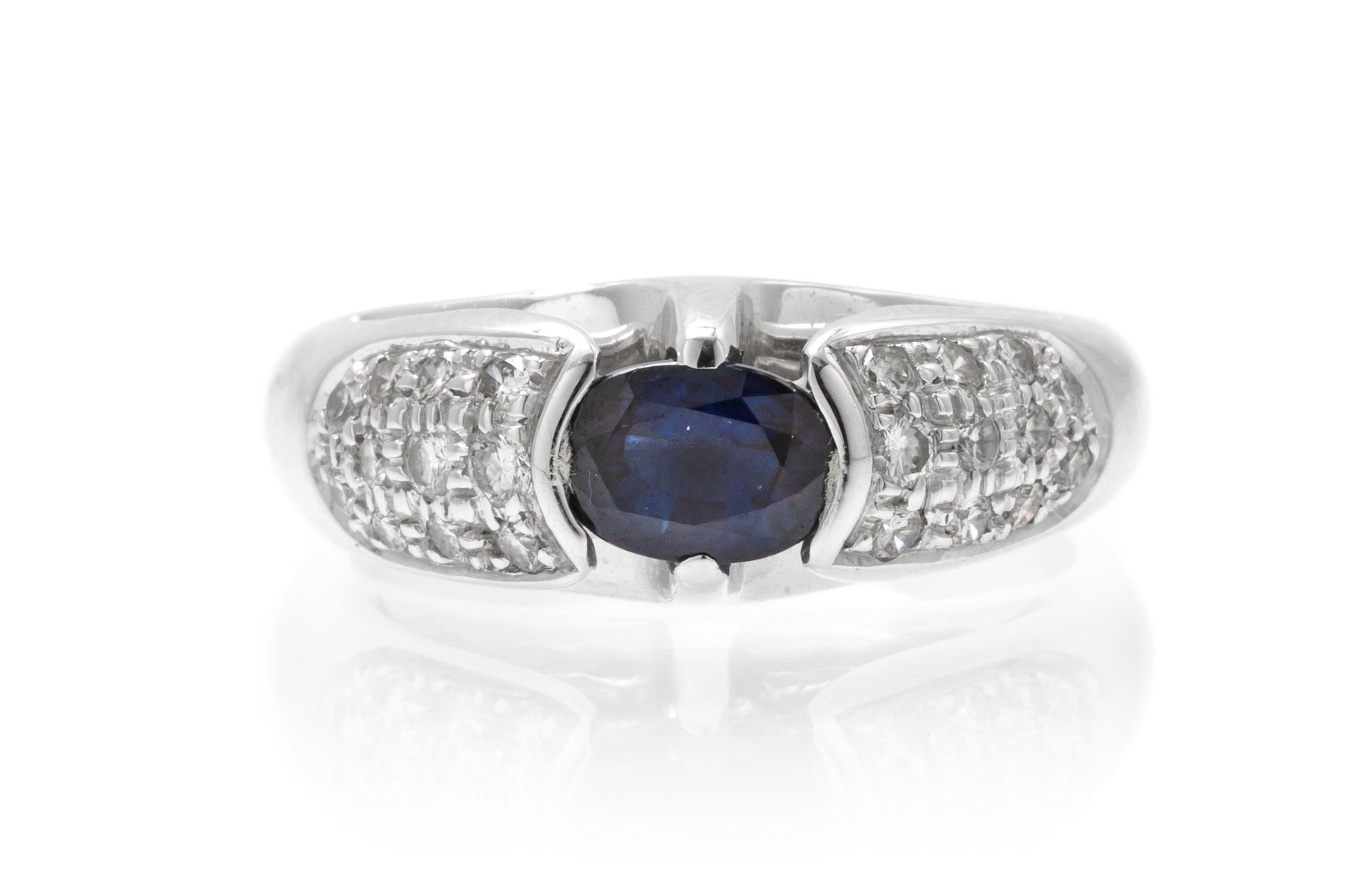 An 18 Karat White Gold, Sapphire and Diamond Ring, 6.50 dwts.