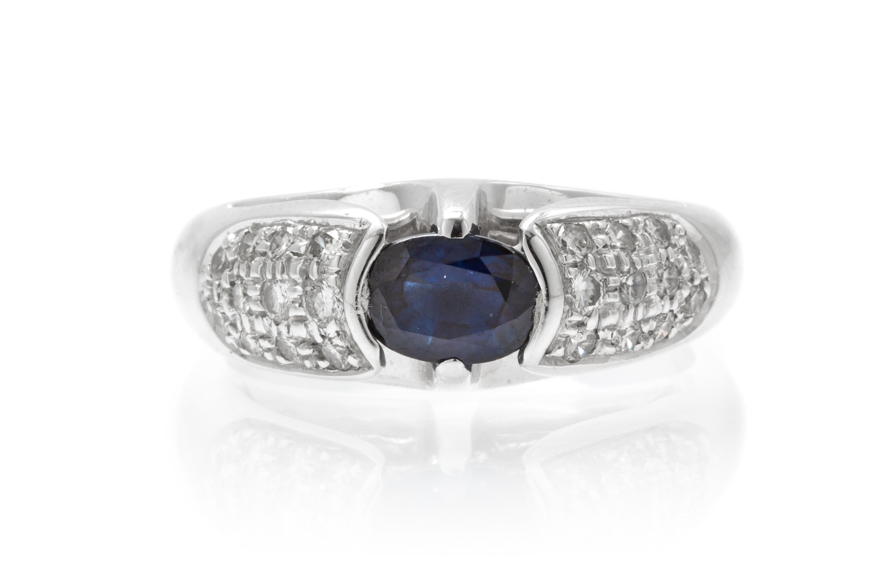 An 18 Karat White Gold, Sapphire and Diamond Ring, 6.50 dwts.