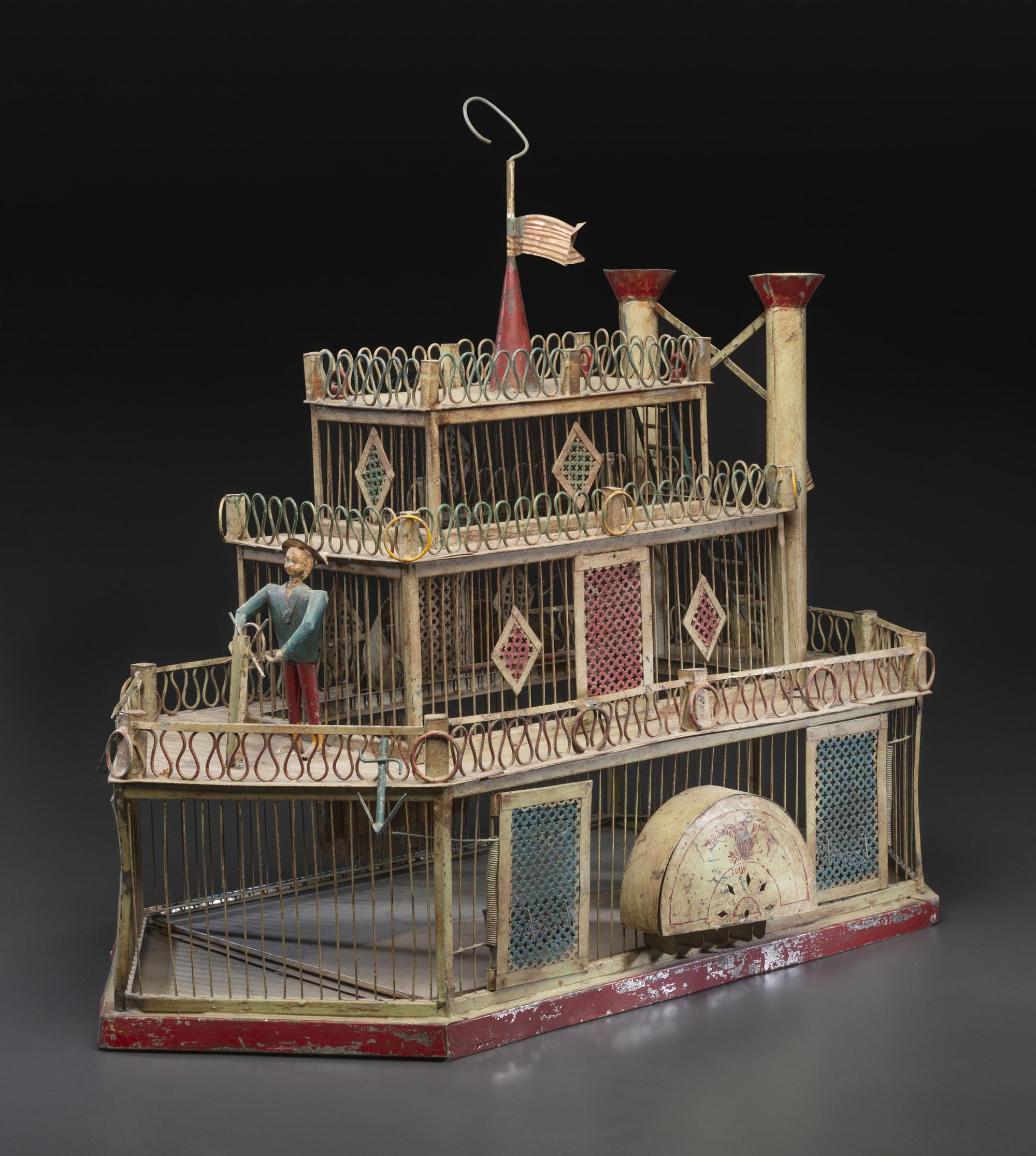 A Painted Sheet Metal and Wire Steamboat Form Birdcage