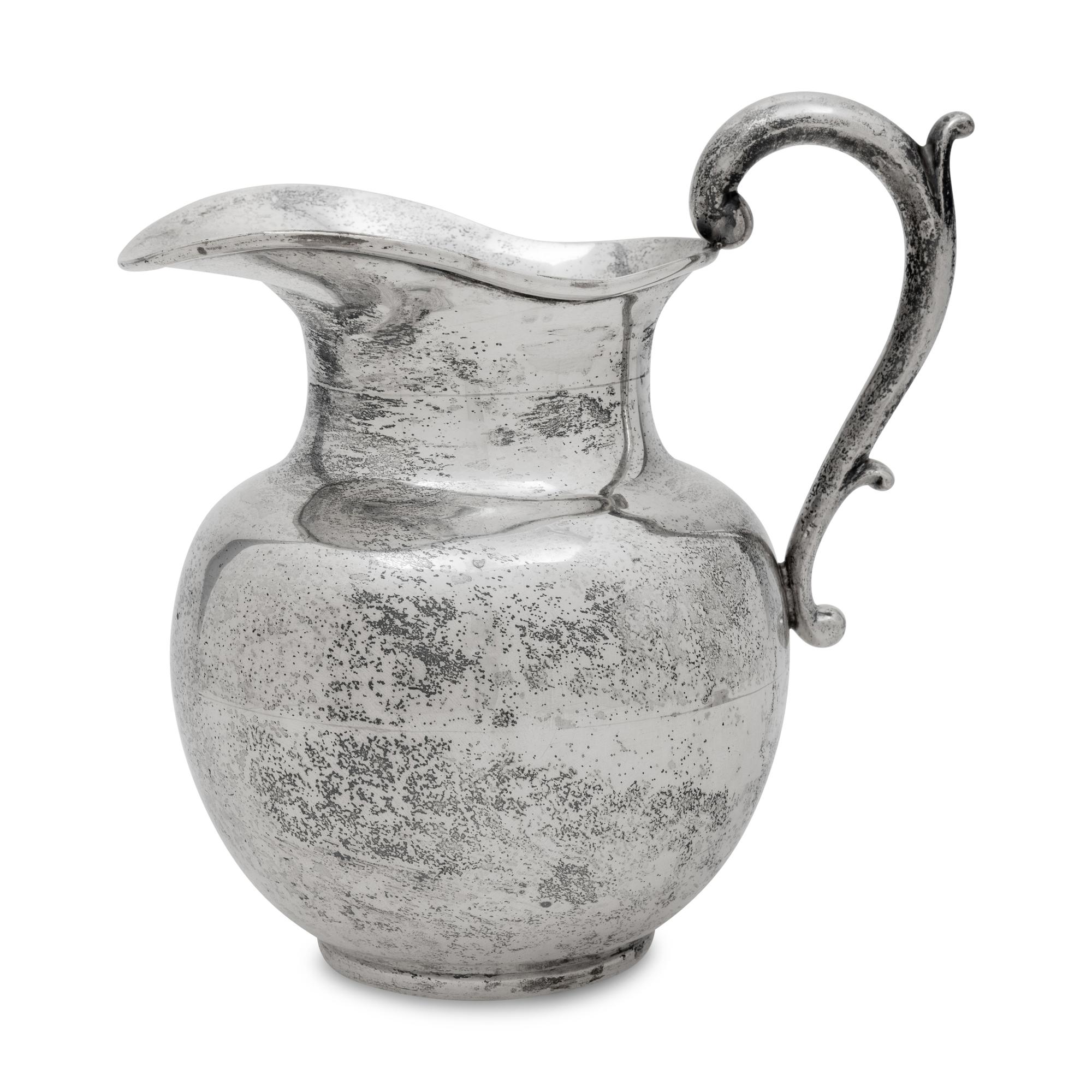 A Mexican Silver Water Pitcher