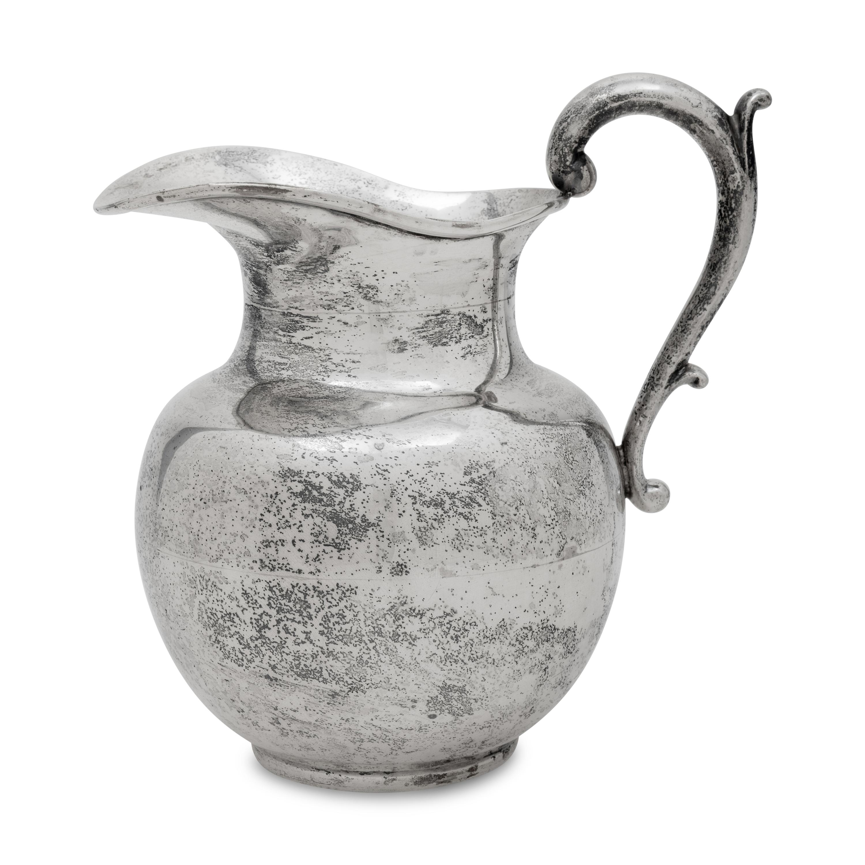 A Mexican Silver Water Pitcher