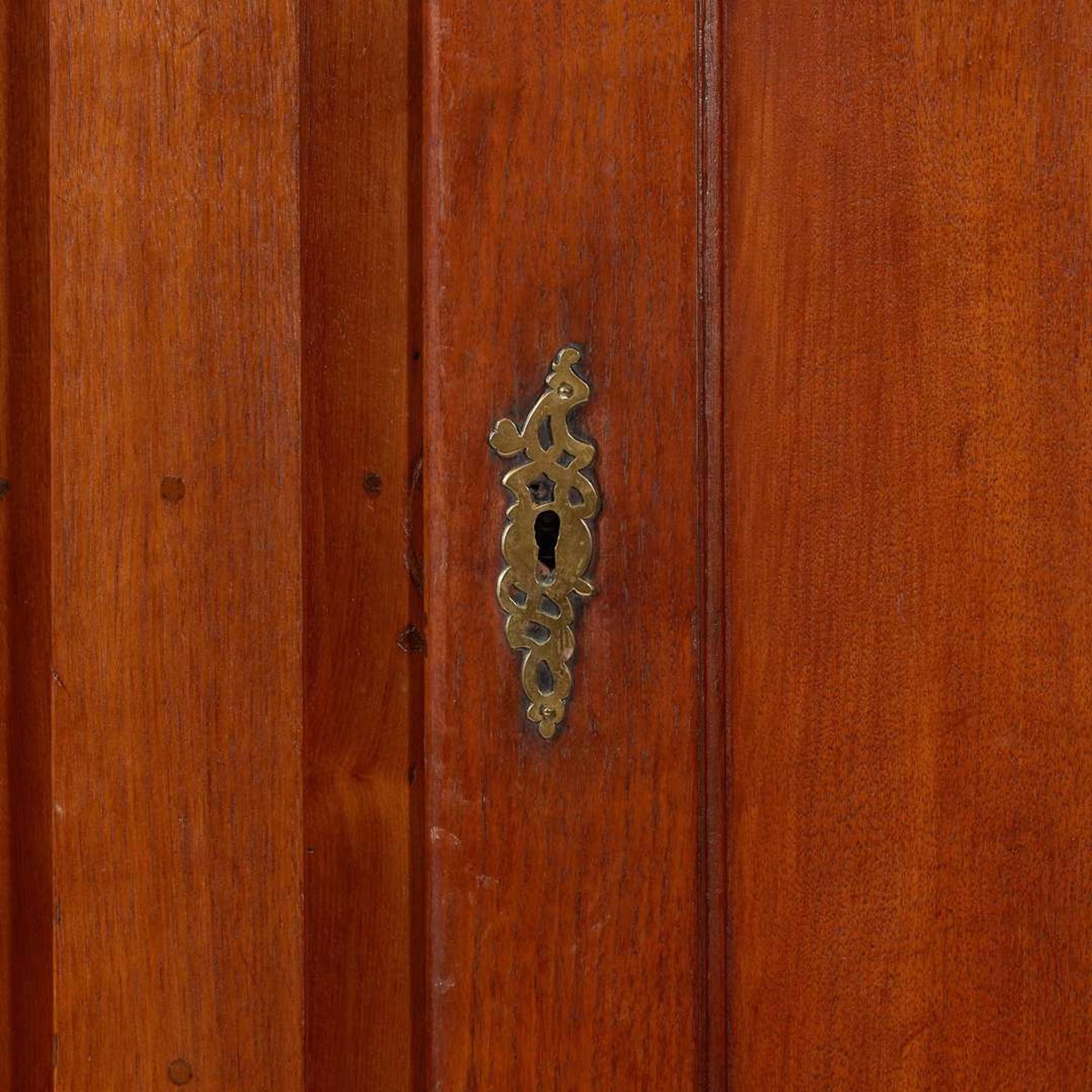 A Chippendale carved walnut cupboard Probably Lancaster County, PA, late 18th century