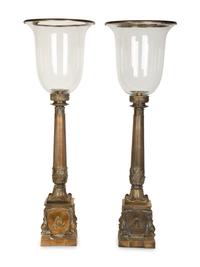 A Pair of Continental Cast Metal Hurricane Candlesticks