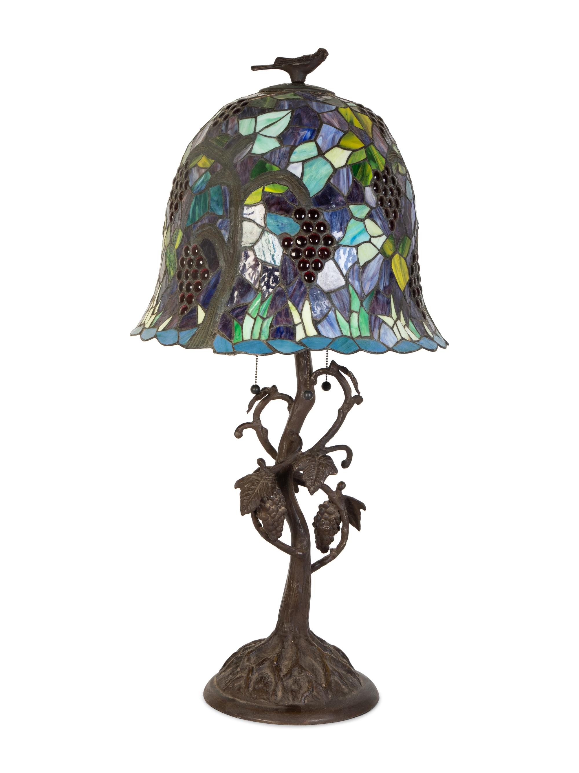 A Leaded Glass and Cast Metal Table Lamp