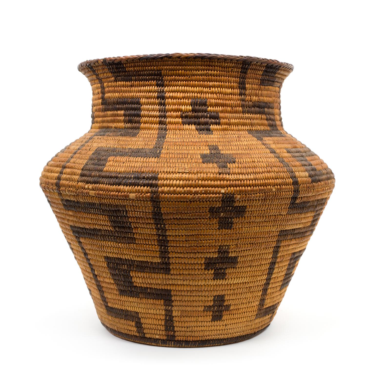 An Apache Olla Basket Height 12 1/2 x diameter 12 inches.