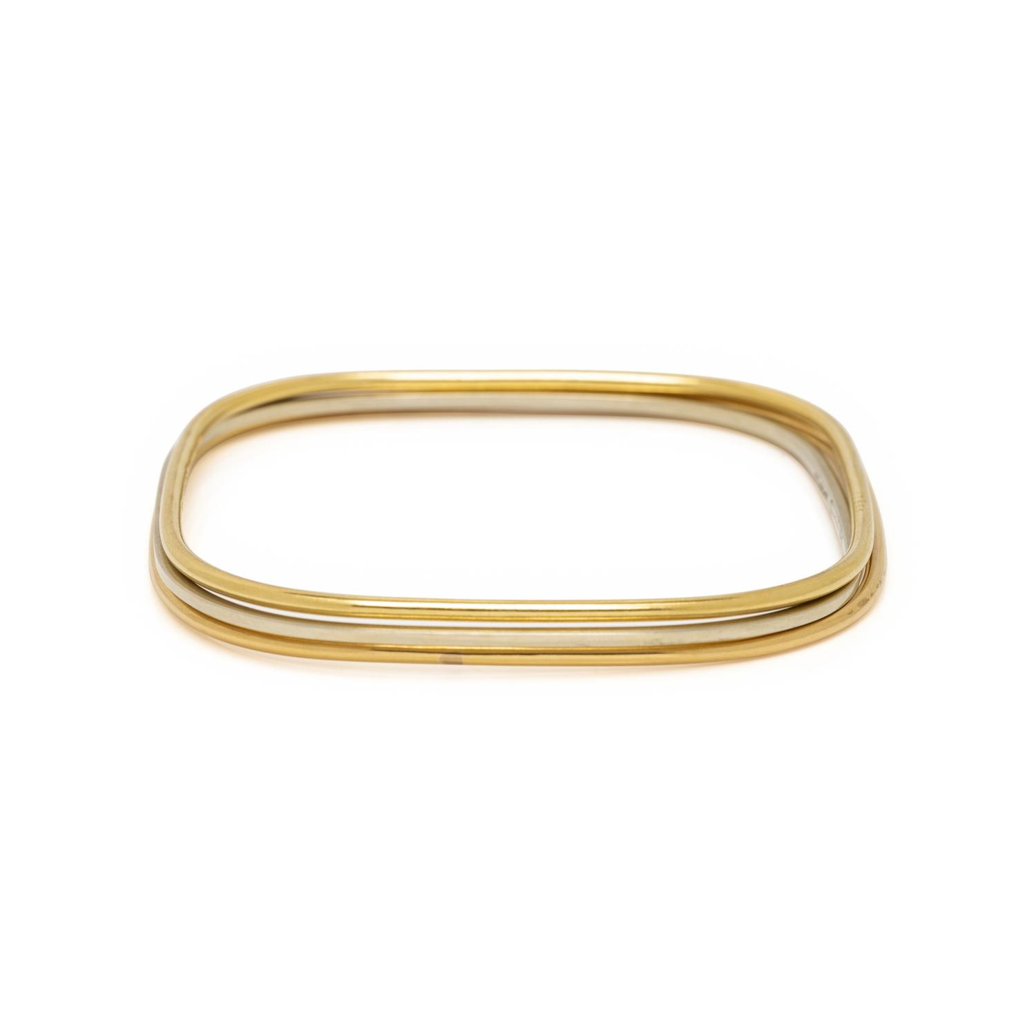 DIHN VAN, CARTIER, TRICOLOR GOLD BANGLE BRACELETS