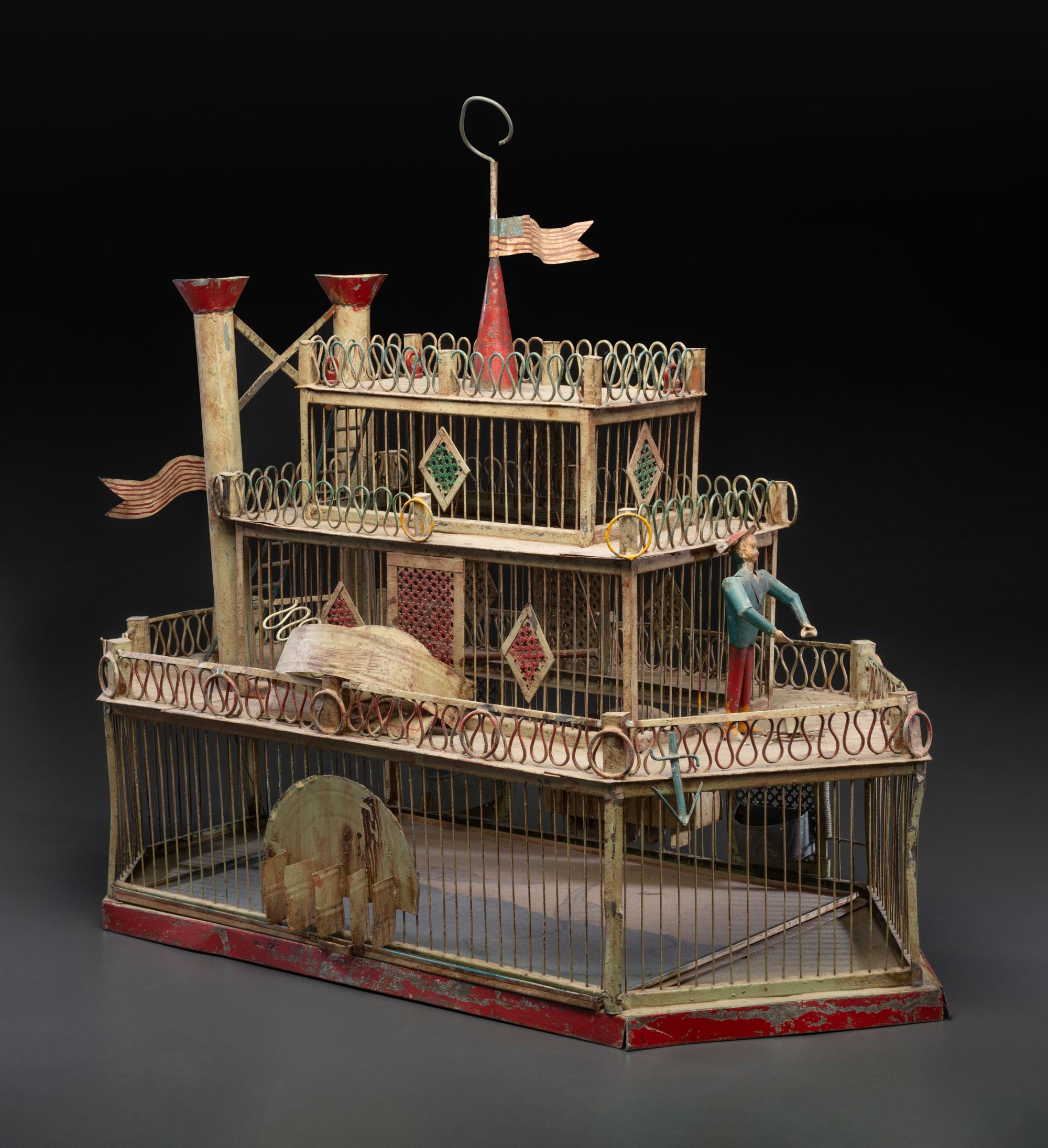 A Painted Sheet Metal and Wire Steamboat Form Birdcage