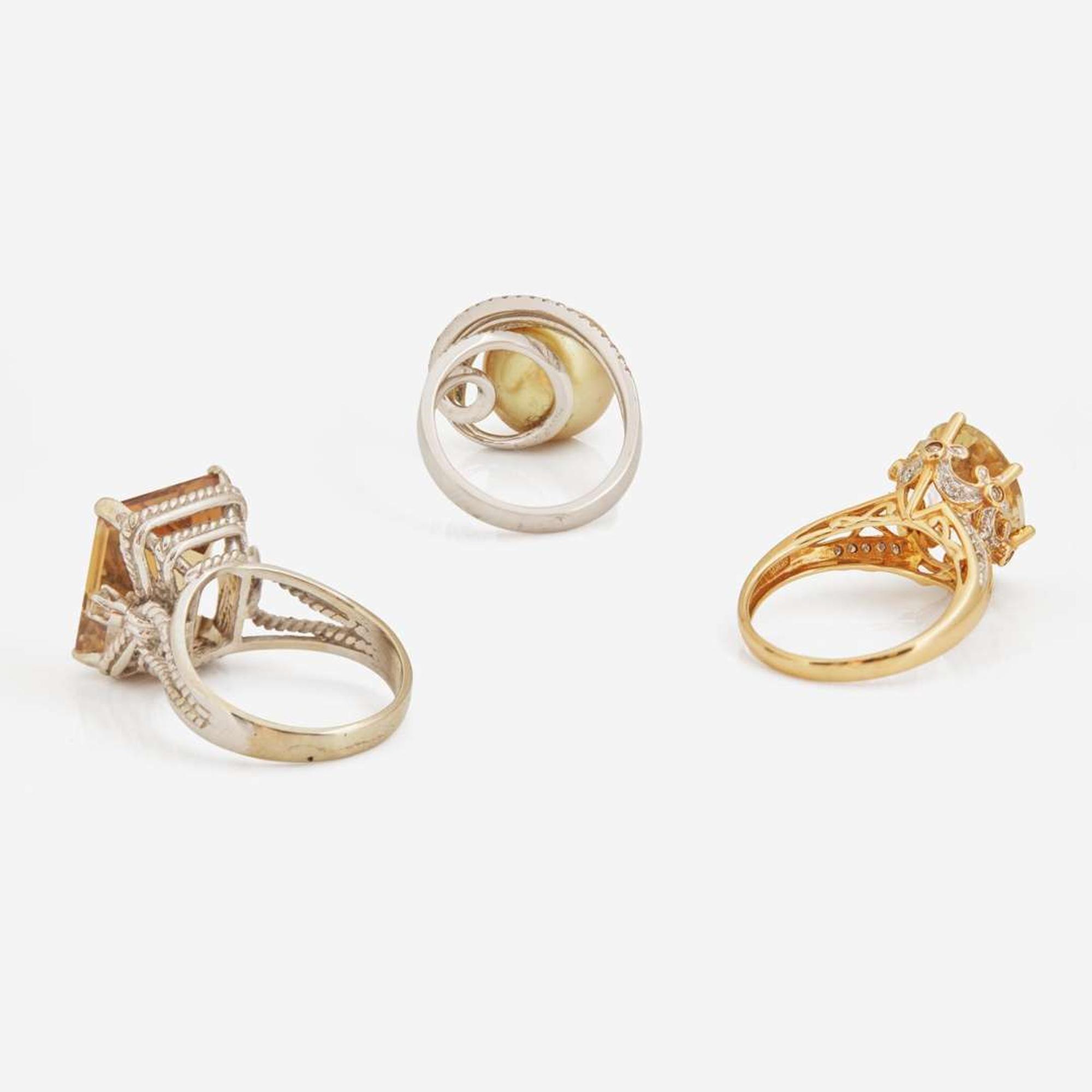 A Collection of Three Contemporary Gold and Gemstone Rings