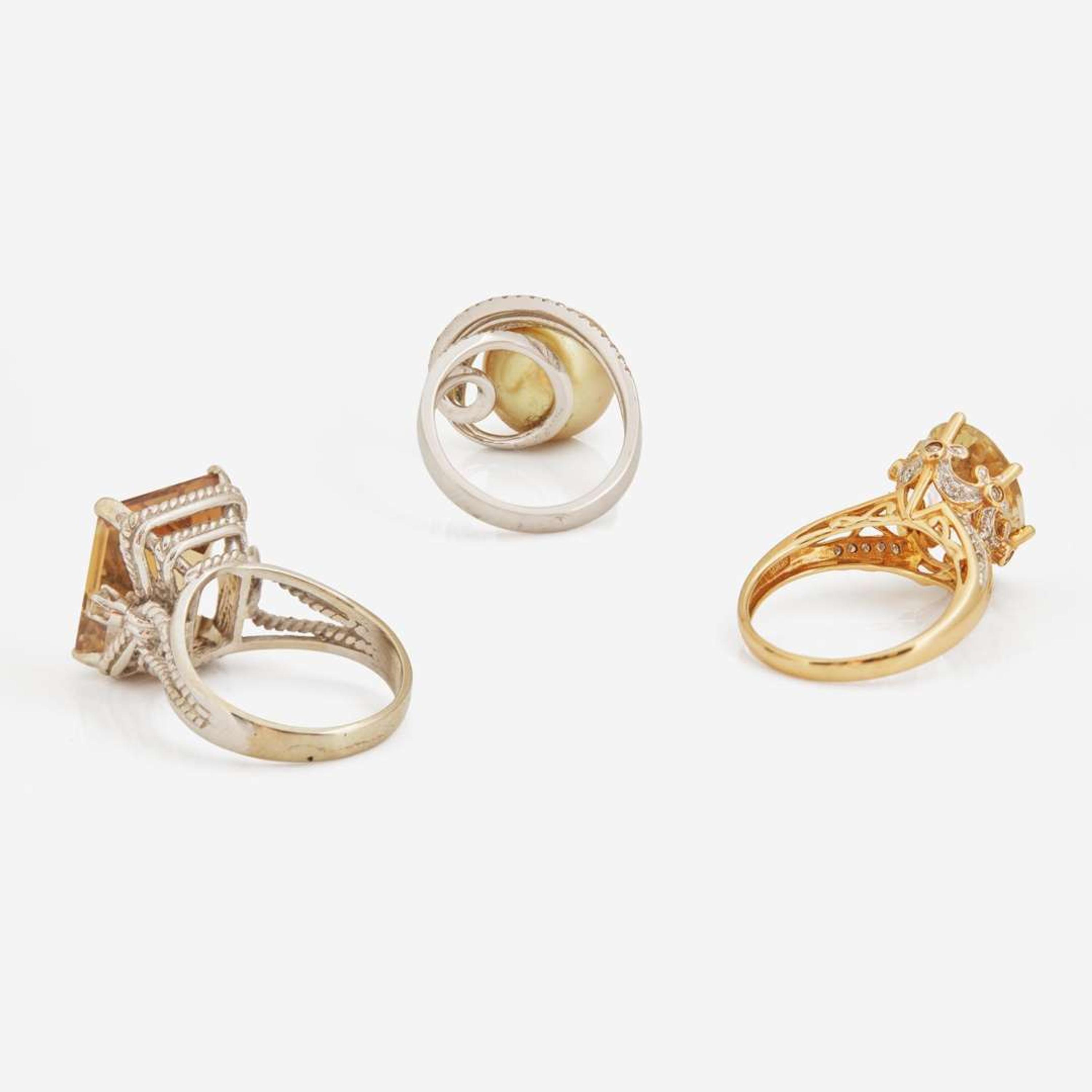 A Collection of Three Contemporary Gold and Gemstone Rings