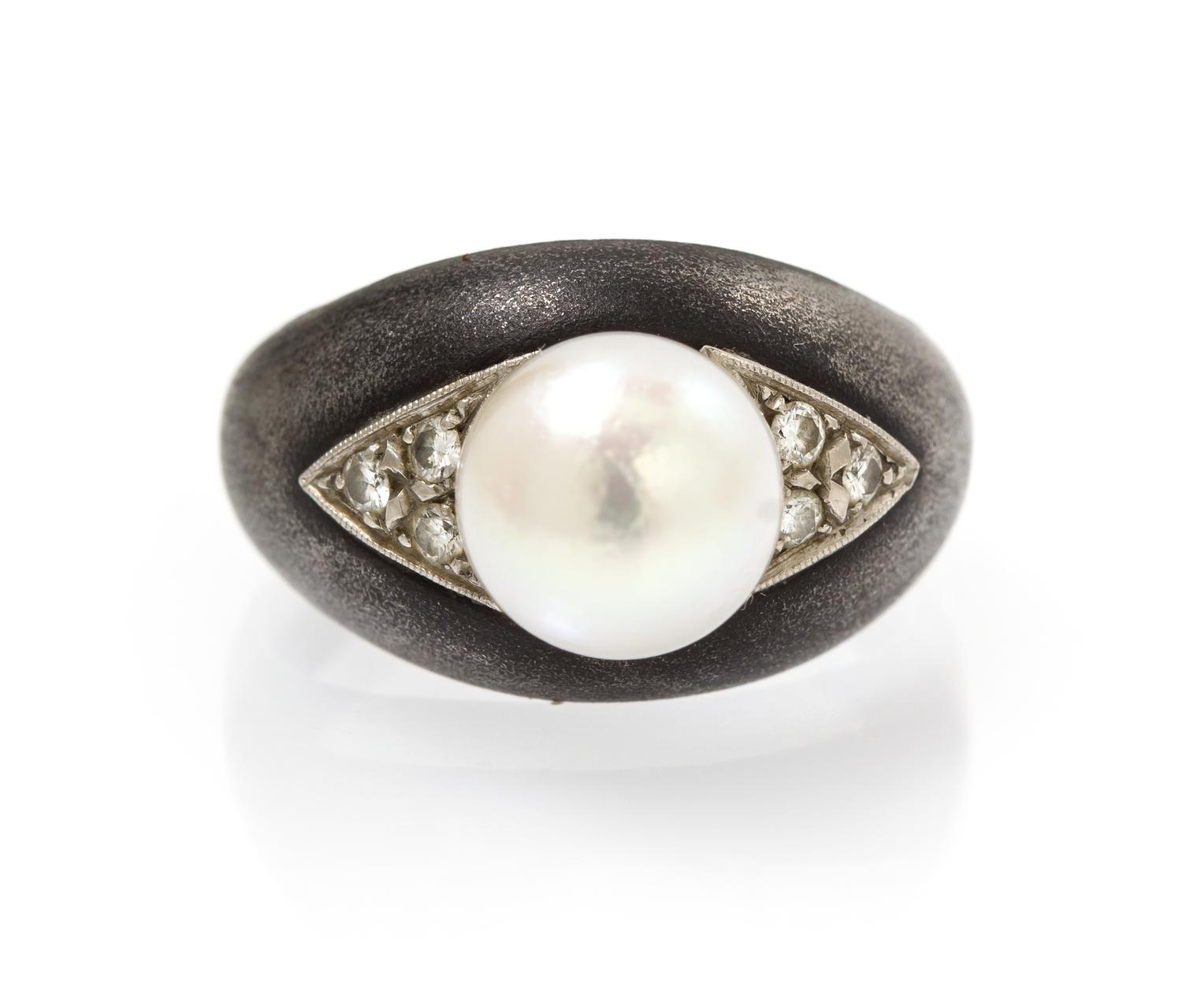 An Art Moderne Blackened Steel, White Gold, Cultured Pearl and Diamond Ring, Marsh & Co., 4.10 dwts.