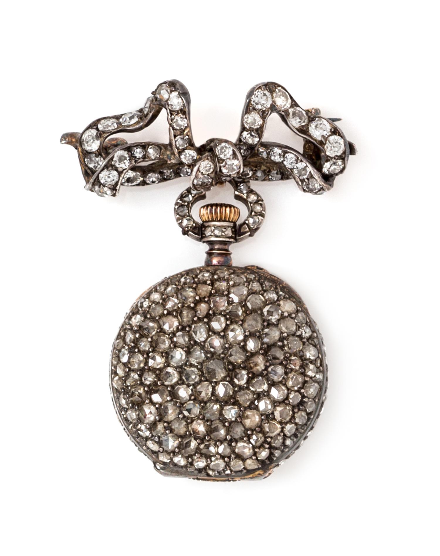 A Silver, Gold and Diamond Lapel Watch, 13.00 dwts.