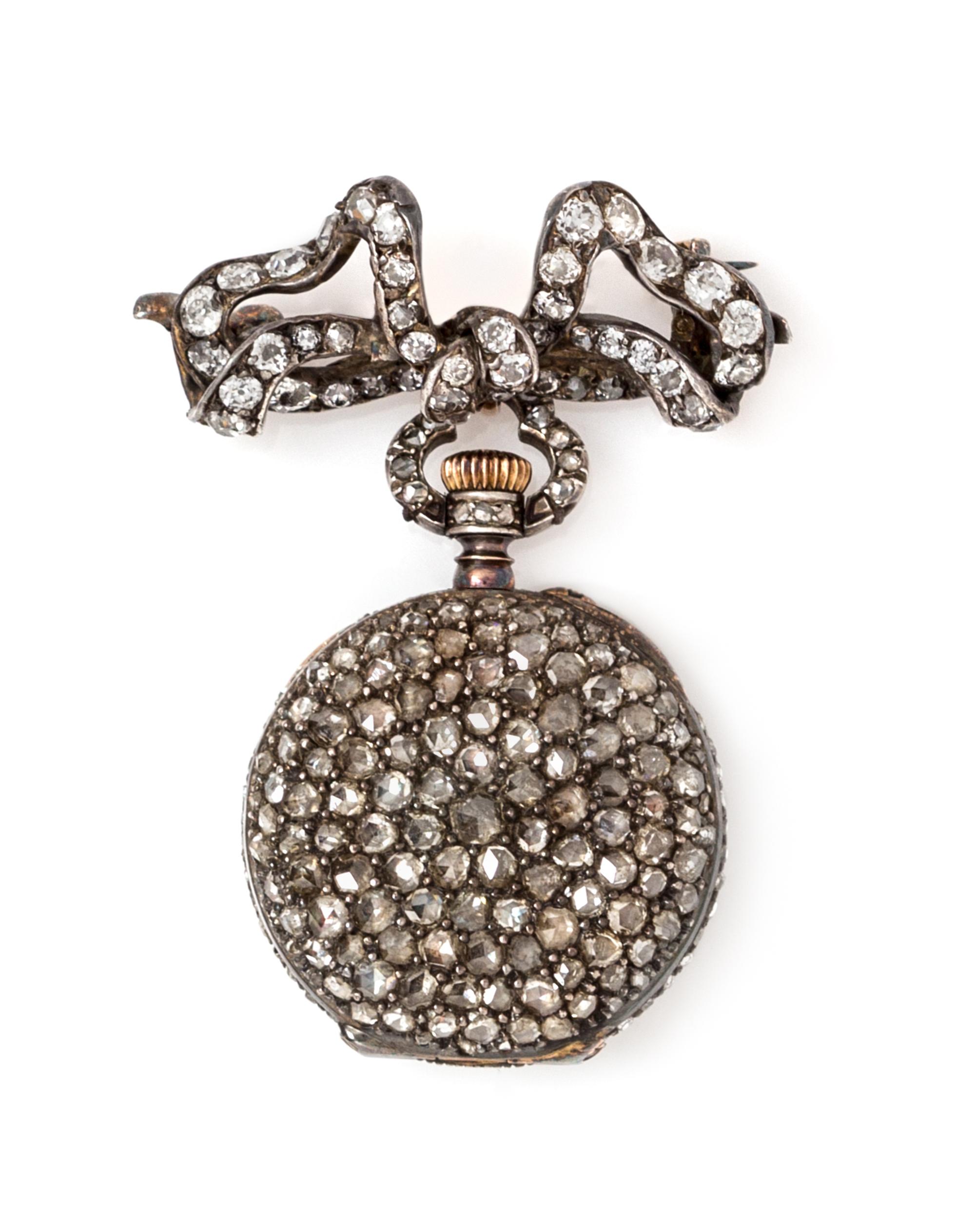 A Silver, Gold and Diamond Lapel Watch, 13.00 dwts.