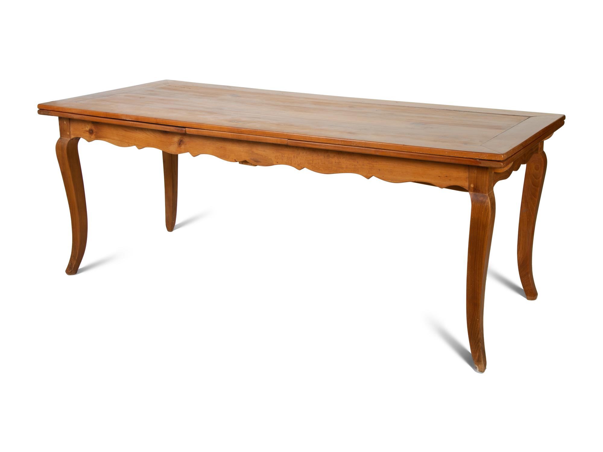 A French Provincial Style Fruitwood Dining Table and Six Side Chairs — 20TH CENTURY
