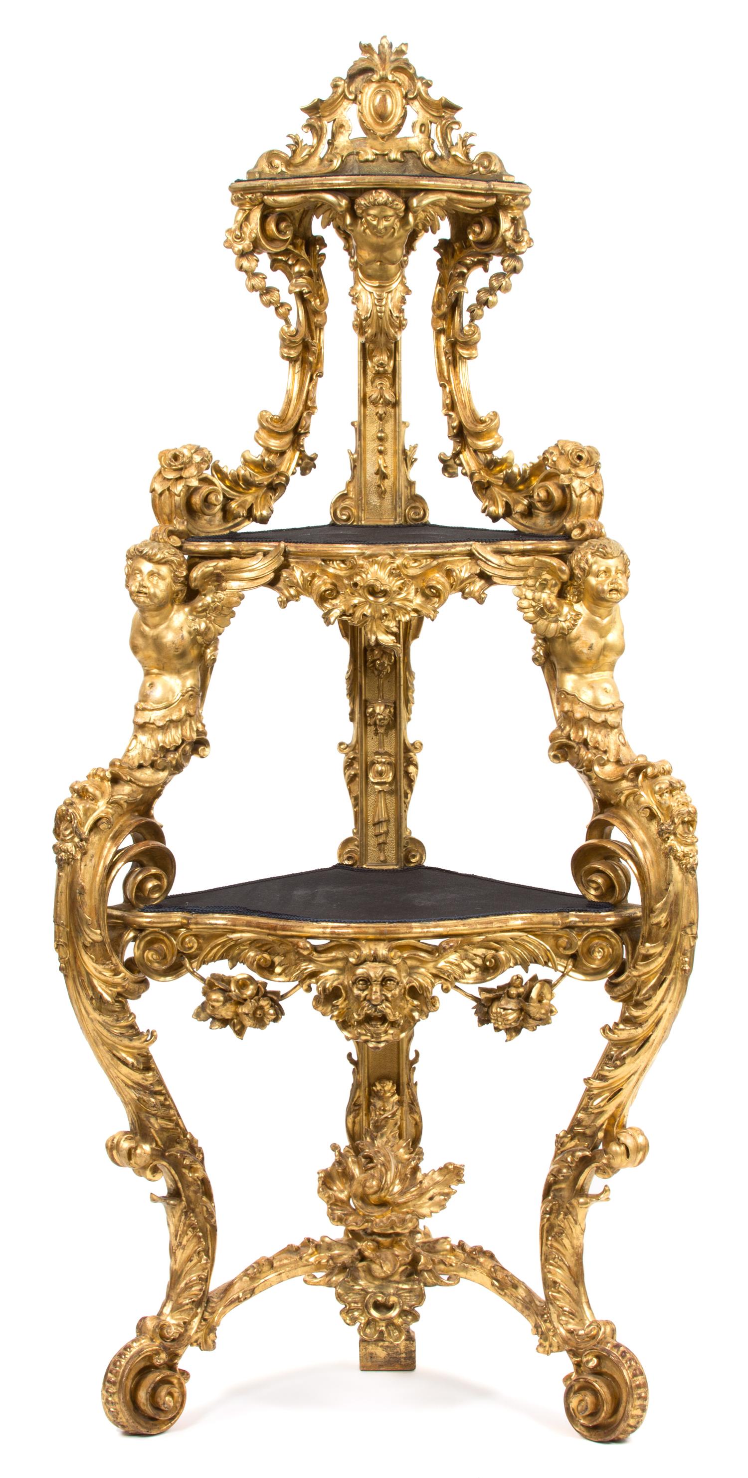 An Italian Rococo Carved Giltwood Corner Etagere Height 86 x width 37 x depth 22 inches. — EARLY 19TH CENTURY