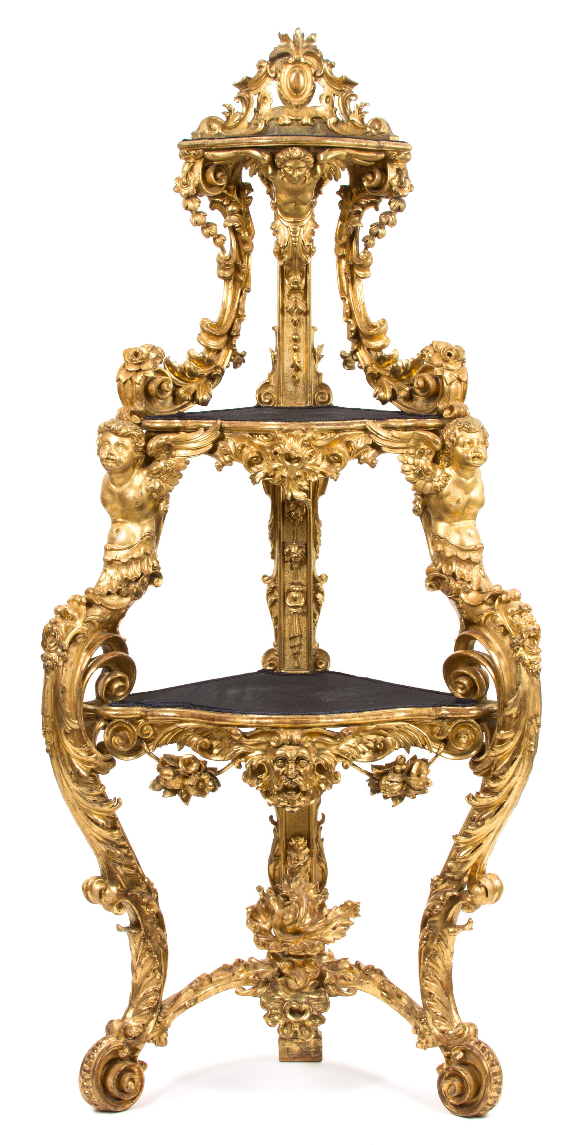 An Italian Rococo Carved Giltwood Corner Etagere Height 86 x width 37 x depth 22 inches. — EARLY 19TH CENTURY
