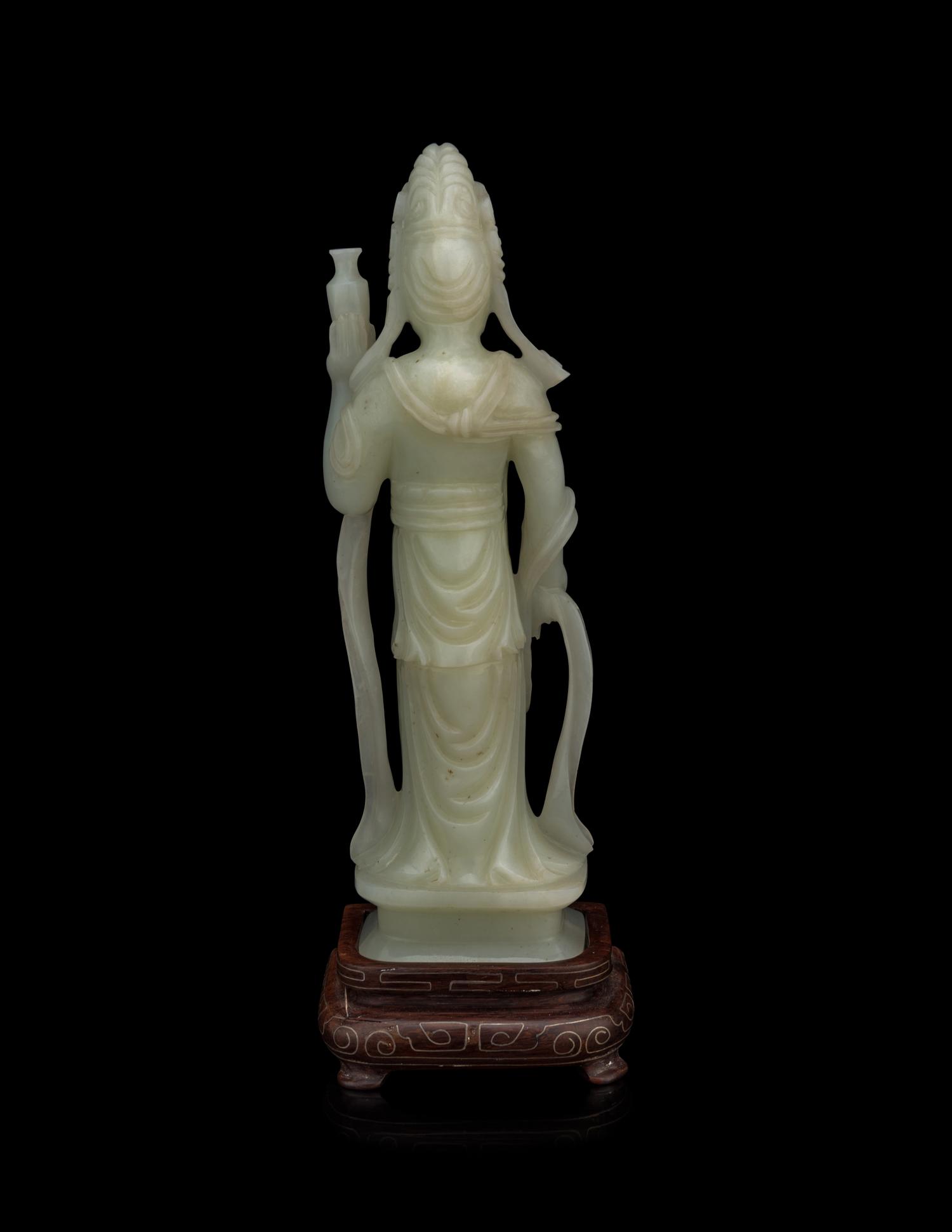 A Pale Celadon Jade Figure of Standing Guanyin