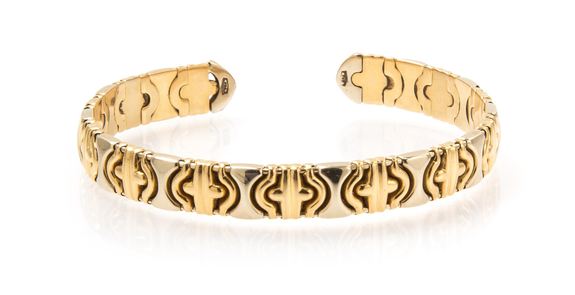 An 18 Karat Yellow and White Gold Bangle Bracelet, 12.20 dwts.
