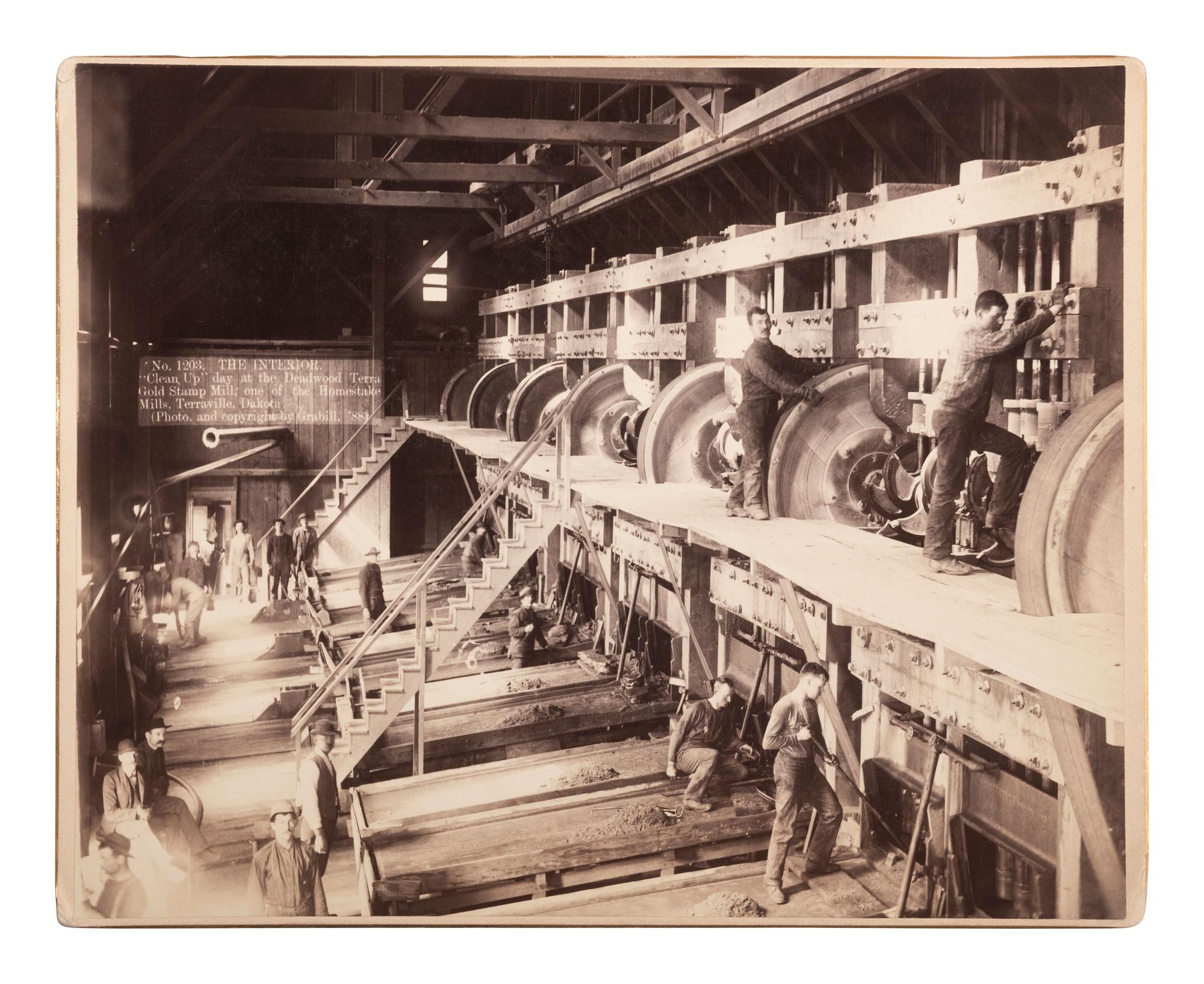 [WESTERN AMERICANA]. GRABILL, John C.H. (1849-1903), photographer. The Interior. "Clean Up" day at the Deadwood Terra Gold Stamp Mill; one of the Homestake Mills, Terraville, Dakota . 1888.