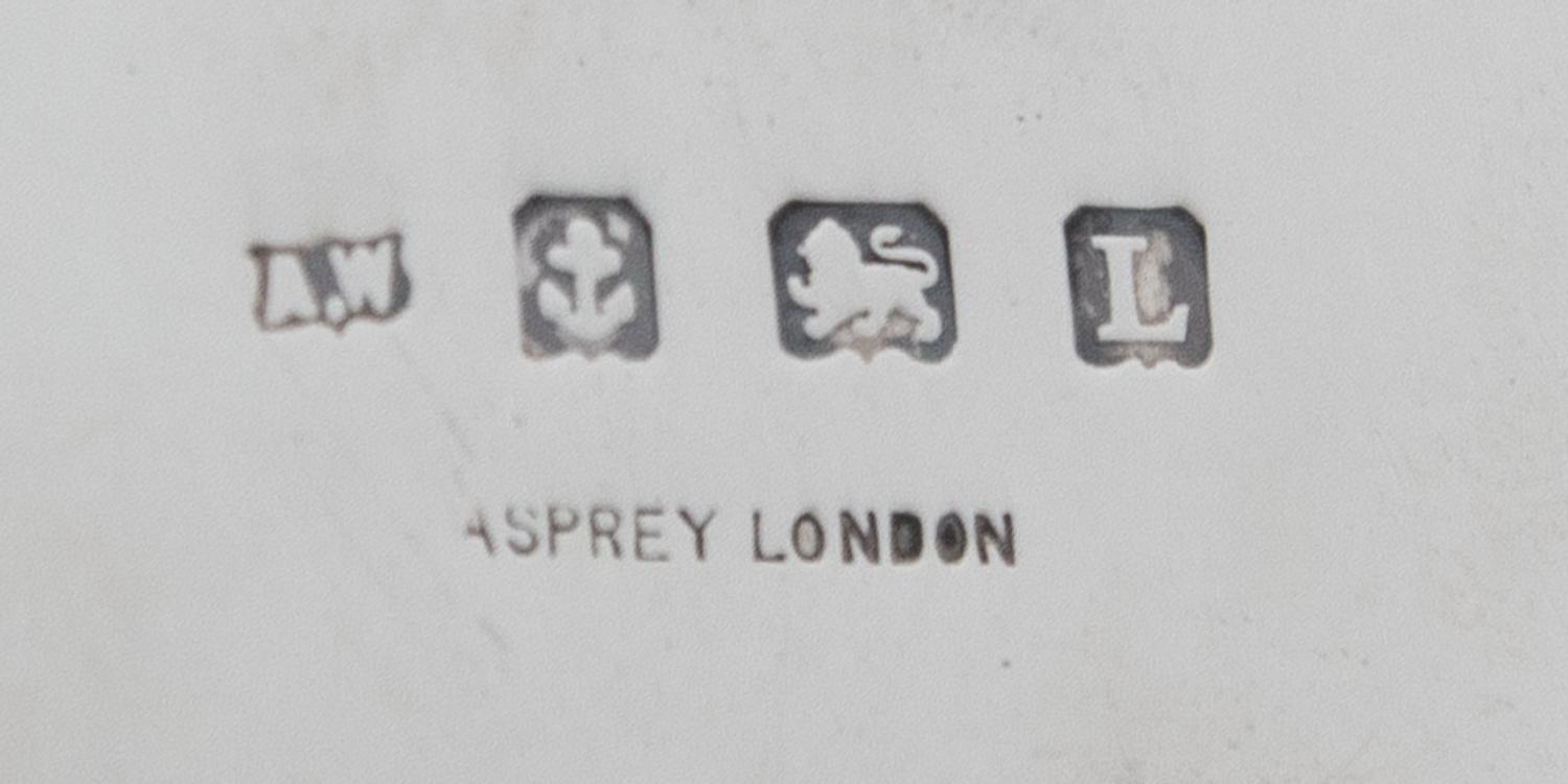 An English Silver and Rose Gold Table Casket, A. Wilcox for Asprey & Co. Ltd., Birmingham, 1935, of rounded rectangular form, the lid w