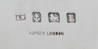 An English Silver and Rose Gold Table Casket, A. Wilcox for Asprey & Co. Ltd., Birmingham, 1935, of rounded rectangular form, the lid w