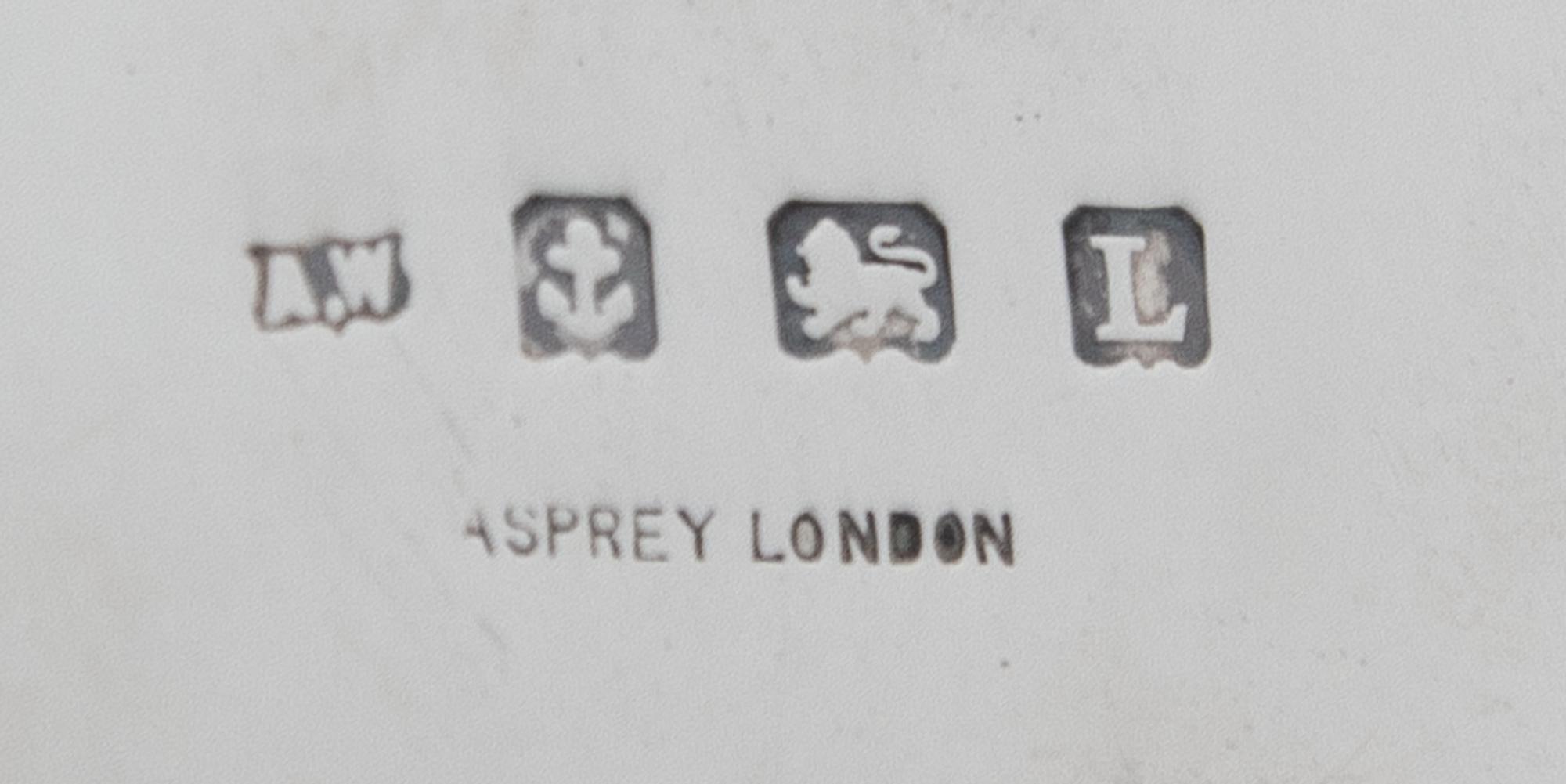 An English Silver and Rose Gold Table Casket, A. Wilcox for Asprey & Co. Ltd., Birmingham, 1935, of rounded rectangular form, the lid w