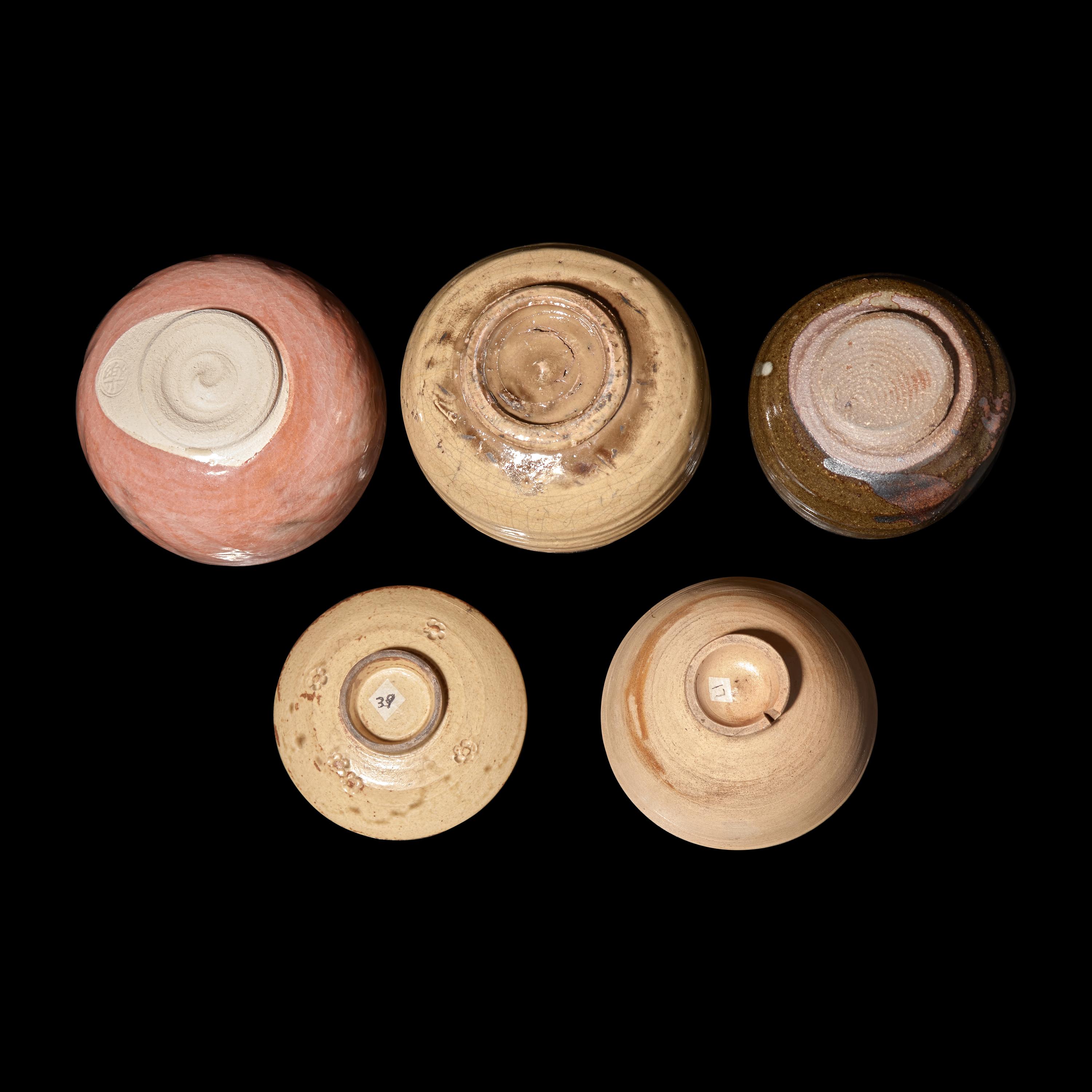 A Group of Four Assorted Japanese Chawan and a Sake Cup, Primarily 20th Century