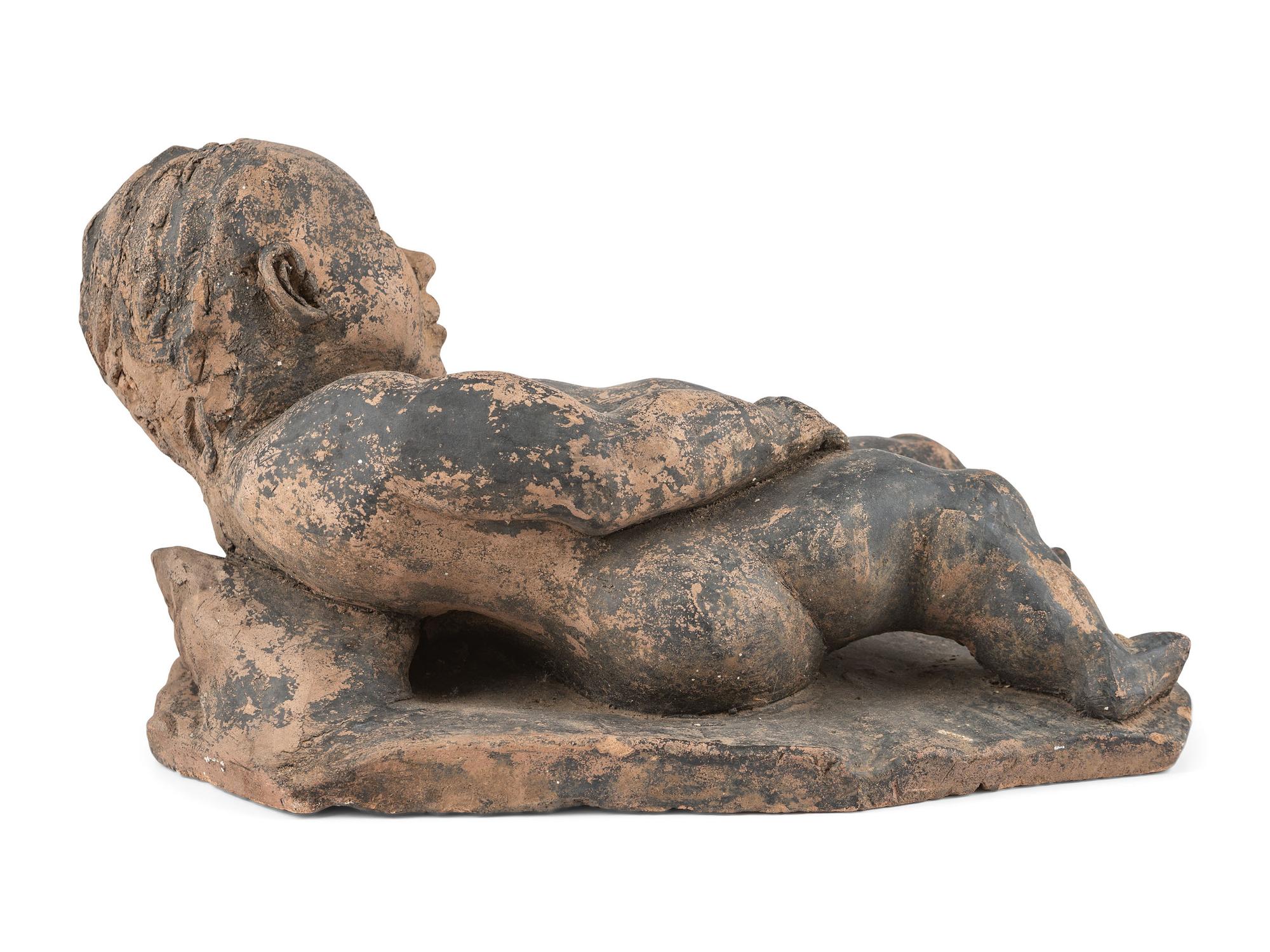 A Clay Roof Tile of a Reclining Baby