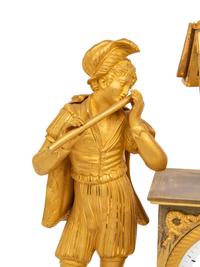 An Empire Gilt Bronze Figural Mantel Clock