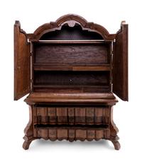A Continental Oak Diminutive Cabinet