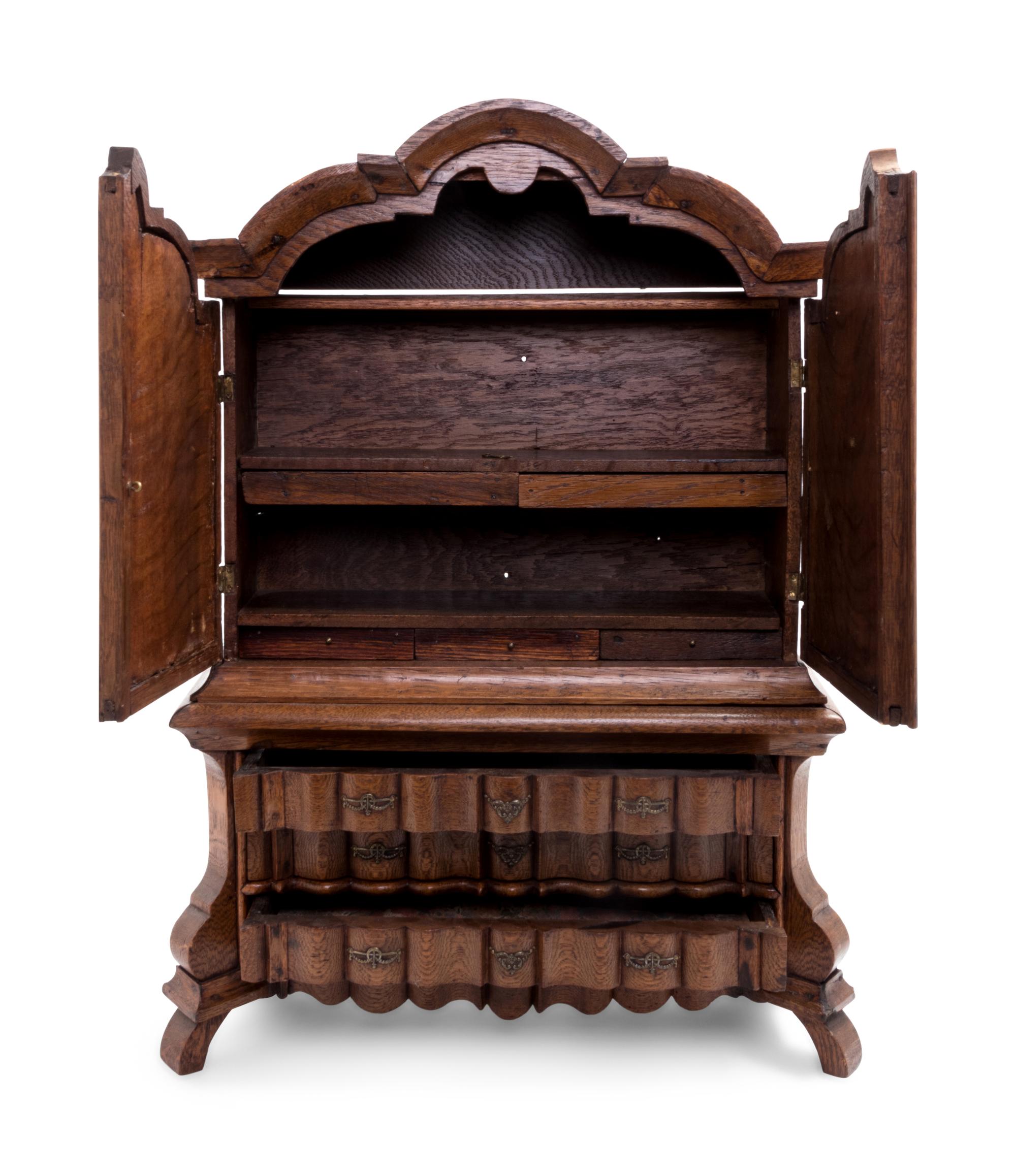 A Continental Oak Diminutive Cabinet