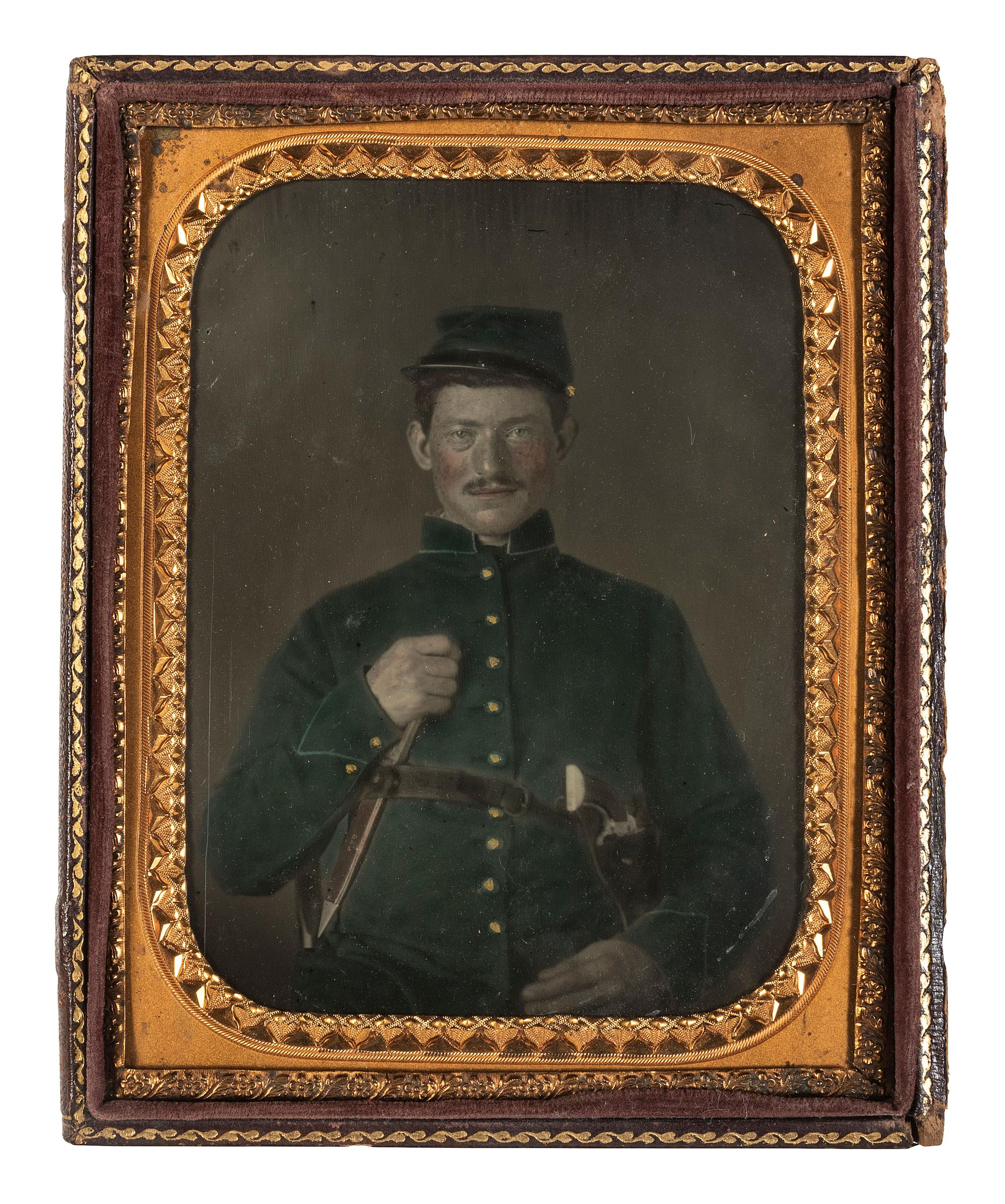 [CIVIL WAR]. Half plate hand-tinted tintype portrait of a doubly armed federal private.