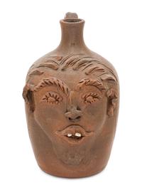 A Cole Pottery Glazed Stoneware Face Jug